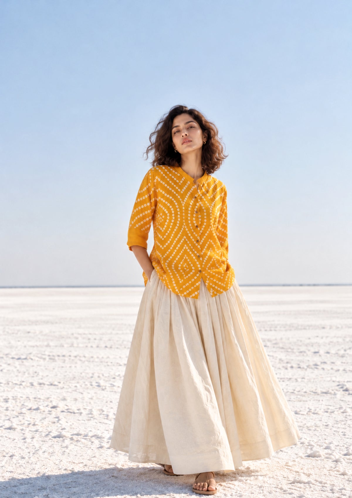 Aamras mango-yellow cotton satin shirt with ivory hand tie-dyed Bandhani patterns, soft mandarin collar and button-down front.