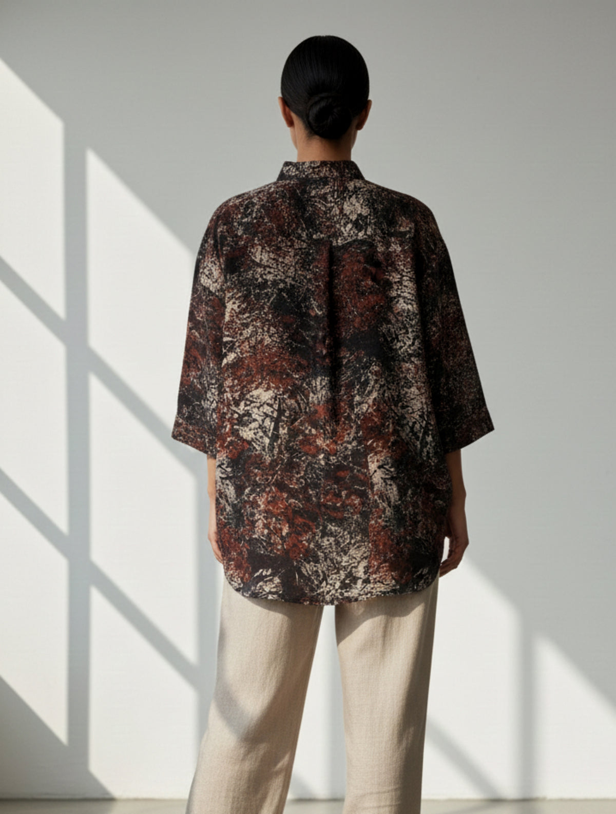 Abstract Ajrakh hand-printed black cotton oversized shirt for women, naturally dyed with mandarin collar.