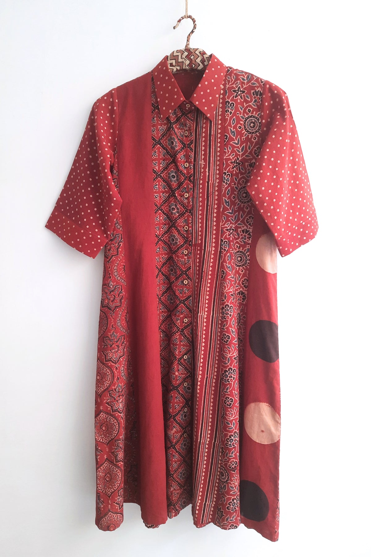 Madder dyed multi Ajrakh hand block printed cotton A-line shirt dress featuring a shirt collar, short sleeves and relaxed silhouette. Naturally dyed, slow made and breathable Indian wear handcrafted by artisans in Gujarat.