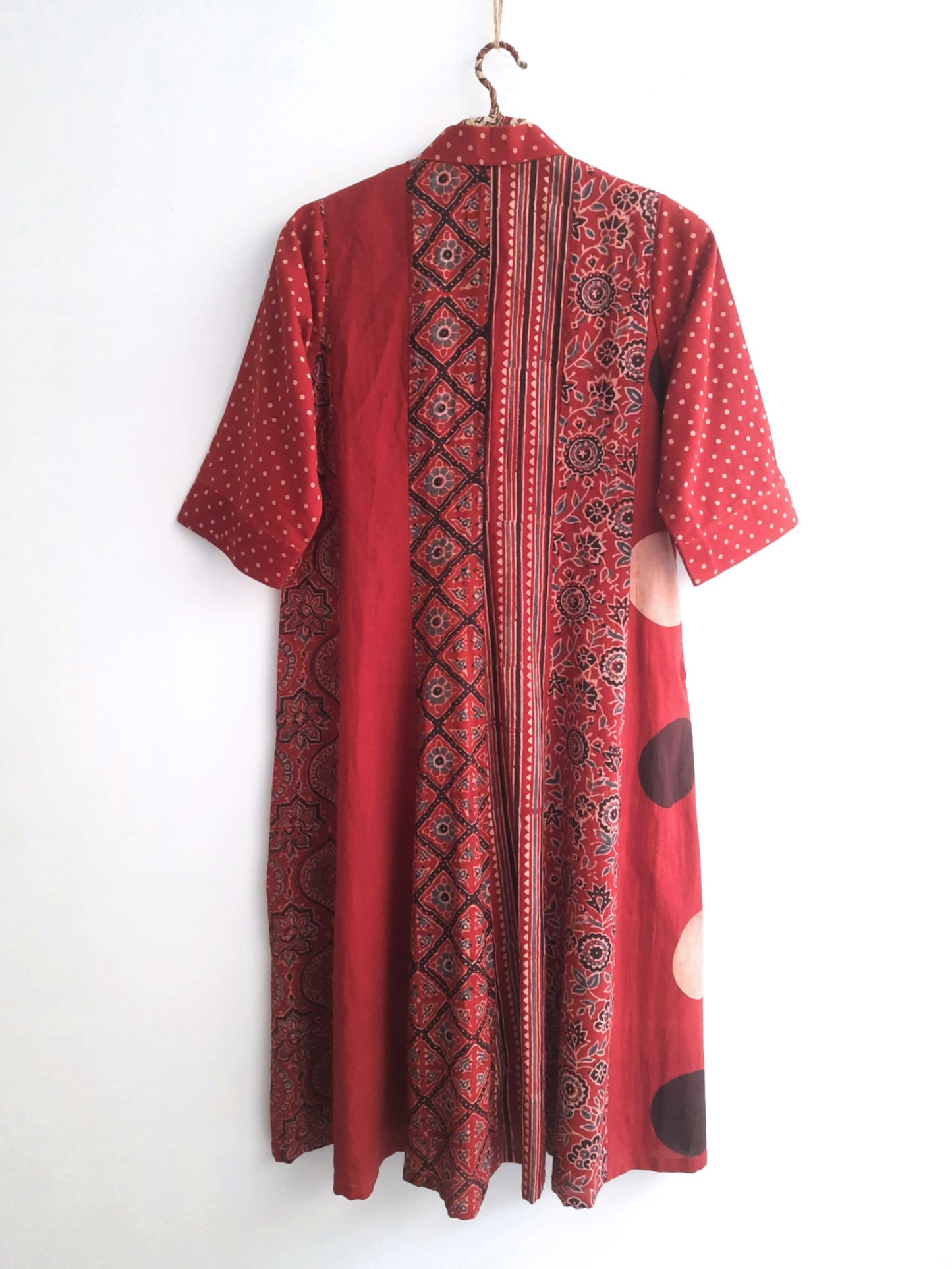Madder dyed multi Ajrakh hand block printed cotton A-line shirt dress featuring a shirt collar, short sleeves and relaxed silhouette. Naturally dyed, slow made and breathable Indian wear handcrafted by artisans in Gujarat.