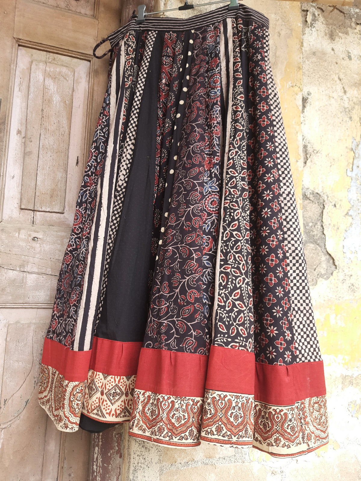 Black natural dyed Ajrakh hand block printed flared kali skirt with multi panel prints, border detailing, lined cotton fabric and drawstring waist