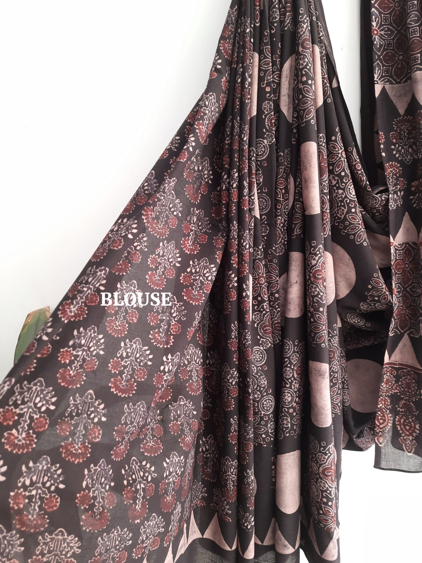 Black natural dyed Ajrakh hand block printed cotton saree crafted using cosmic moon motifs and traditional wooden hand blocks. Pure cotton, breathable, slow made saree with running blouse piece, handmade by artisans in Gujarat.