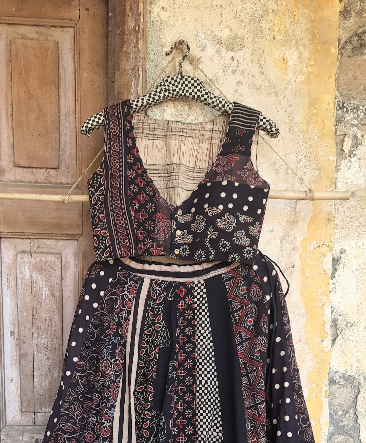 Black natural dyed Ajrakh hand block printed blouse with front button closure, deep curved V-neck, lined and padded cotton fabric