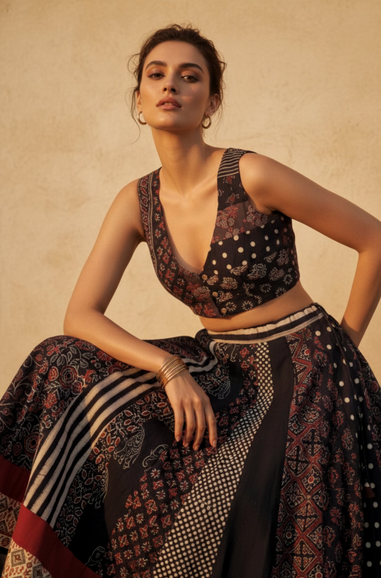 Black natural dyed Ajrakh hand block printed skirt and blouse set with flared kali skirt, multi Ajrakh panels, lined padded blouse and handcrafted details.