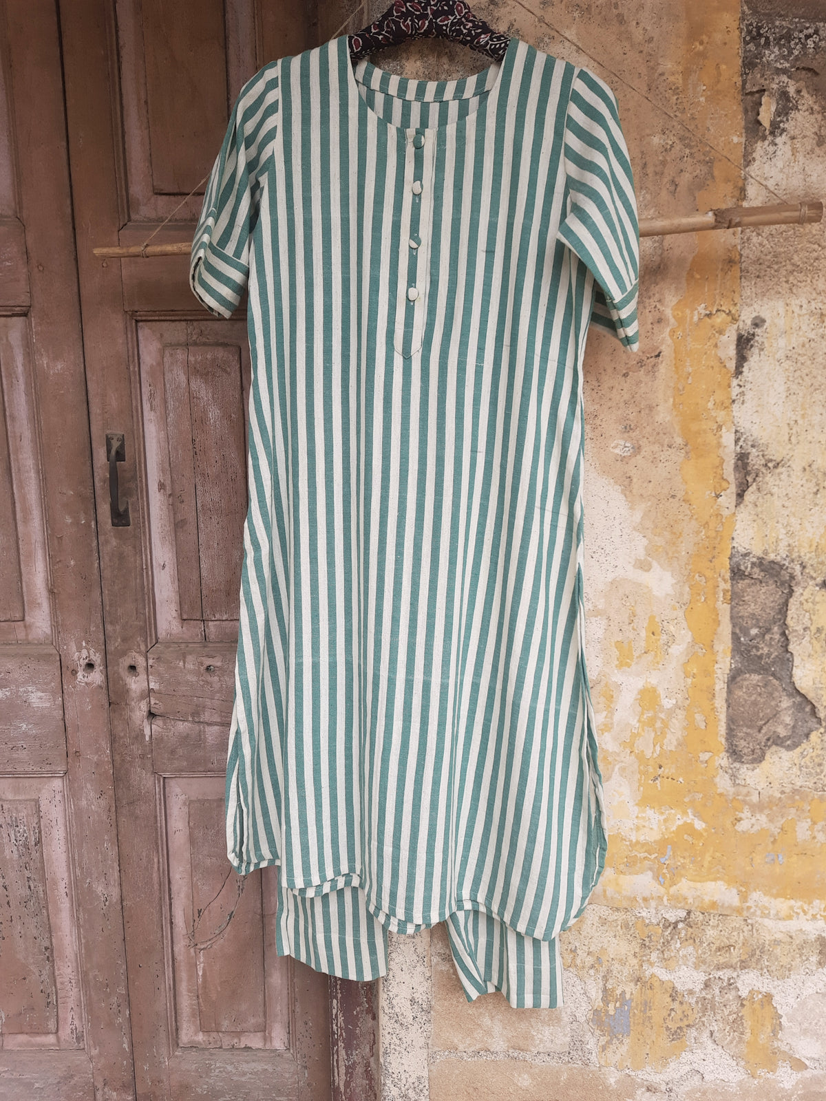 Handwoven organic cotton green and off-white striped co-ord set with round-neck kurta and elasticated waist pants, handmade by artisans, breathable and comfortable sustainable clothing from Turquoisethestore.