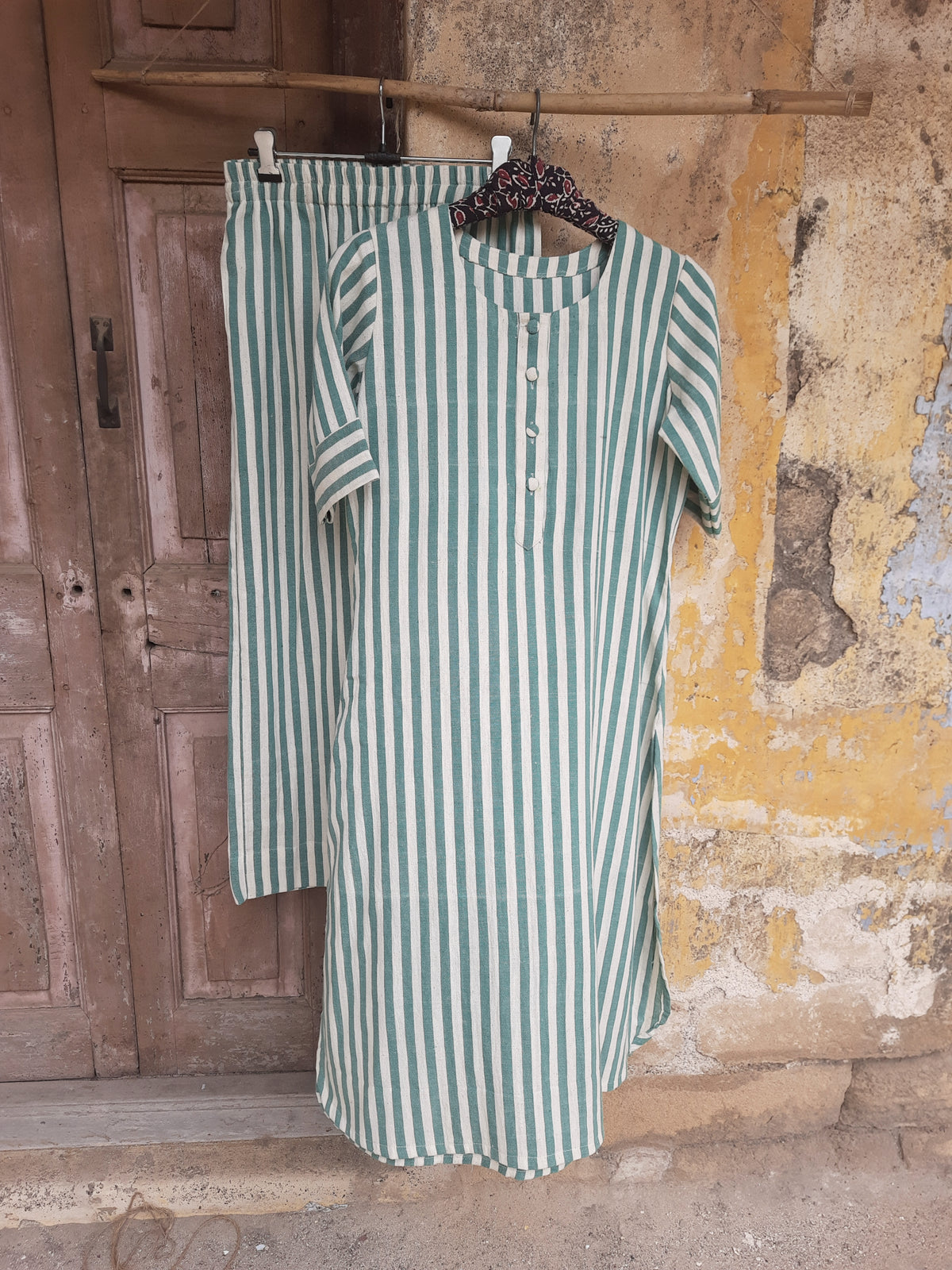 Handwoven organic cotton green and off-white striped co-ord set with round-neck kurta and elasticated waist pants, handmade by artisans, breathable and comfortable sustainable clothing from Turquoisethestore.