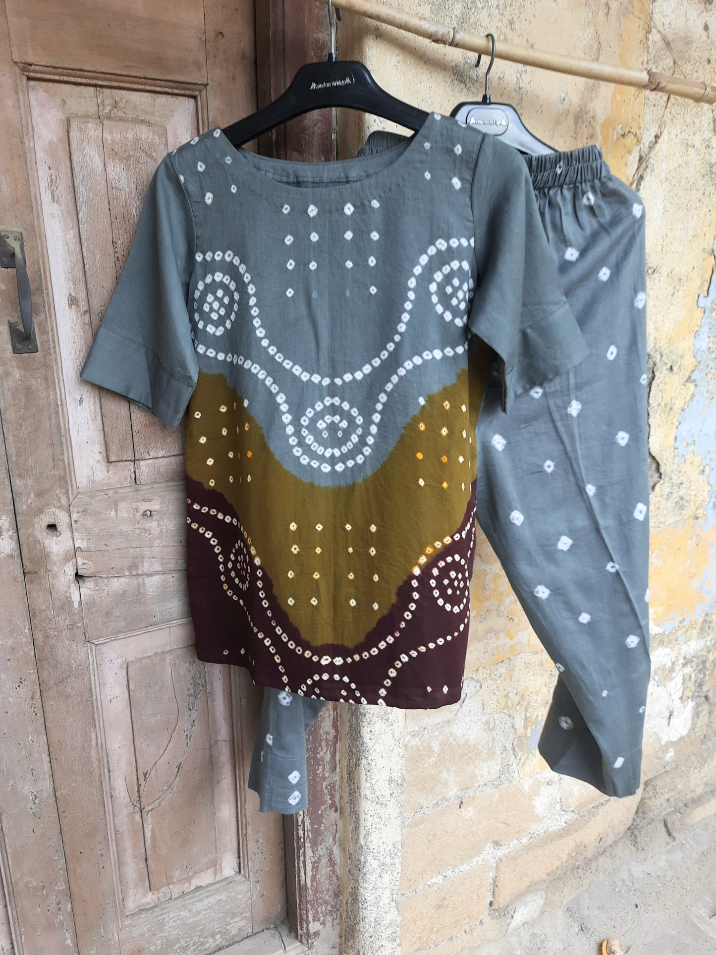 Hand tie-dyed Bandhani three-piece co-ord set in grey, olive and maroon with cotton satin top, elastic pants and cotton dupatta.