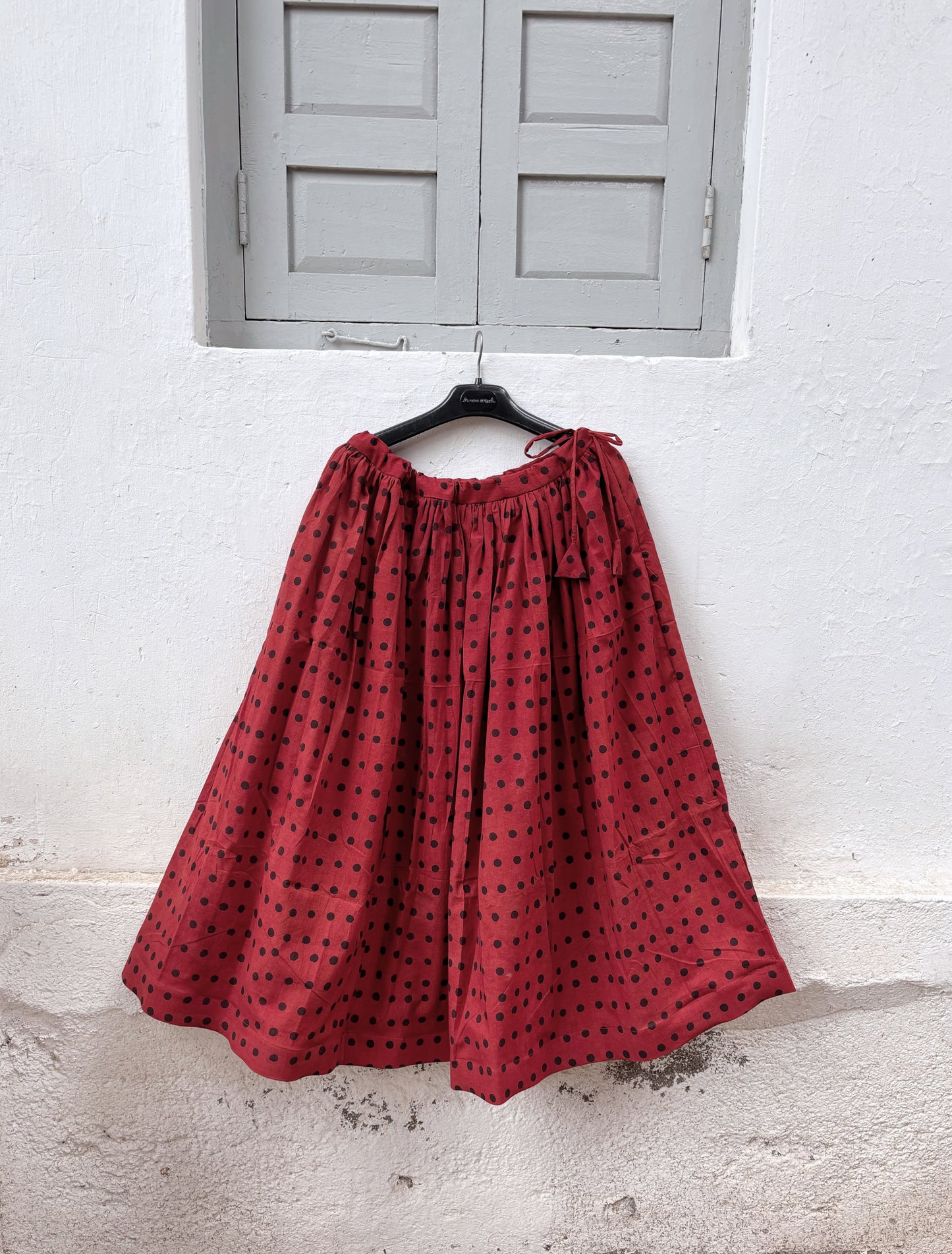 Aaruni madder dyed Ajrakh polka dot cotton coord set with cropped sleeveless shirt and flared skirt