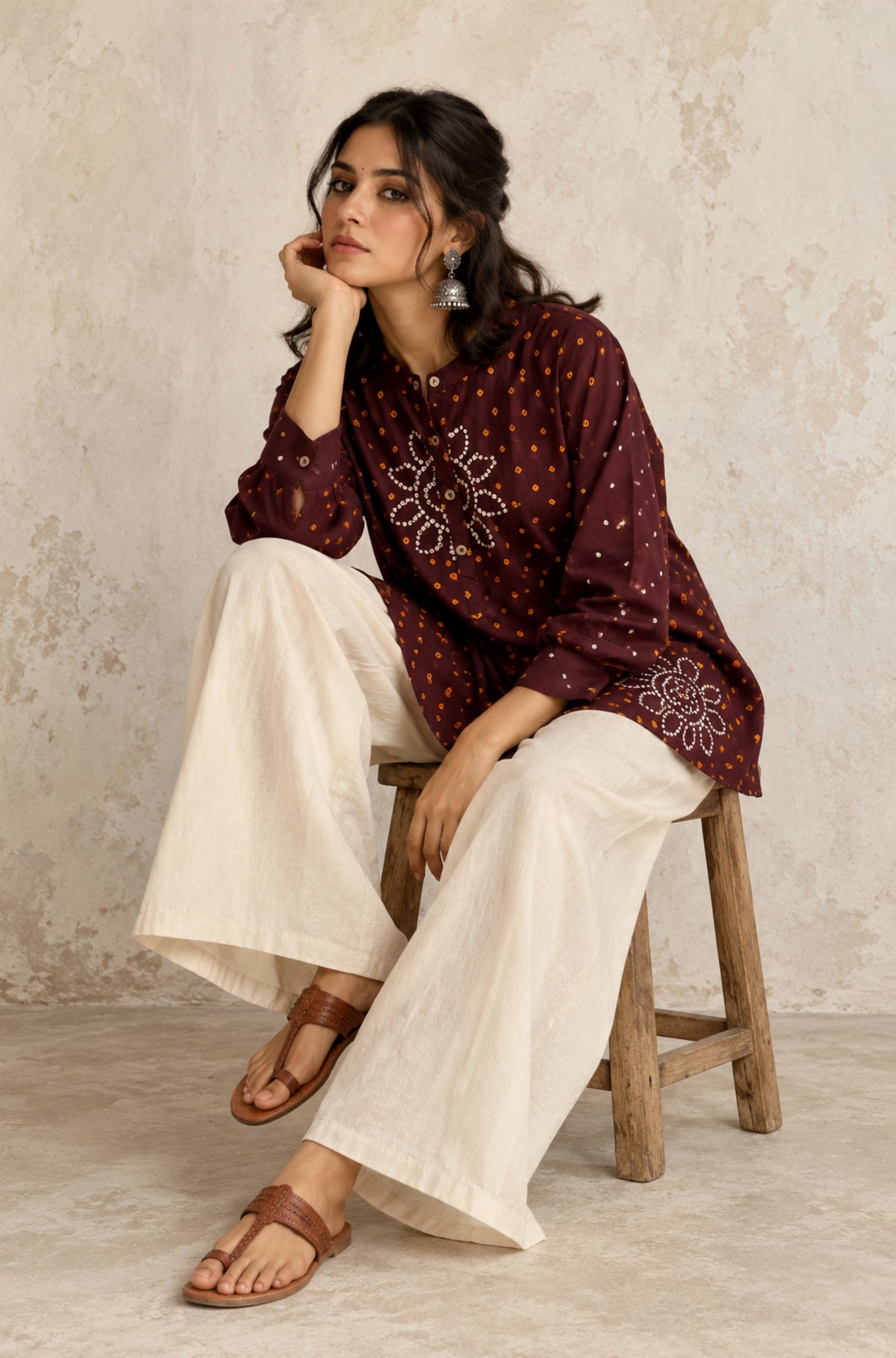 Agnik deep brown cotton shirt with turmeric-yellow and off-white hand tie-dyed Bandhani motifs, soft mandarin collar and partial button placket