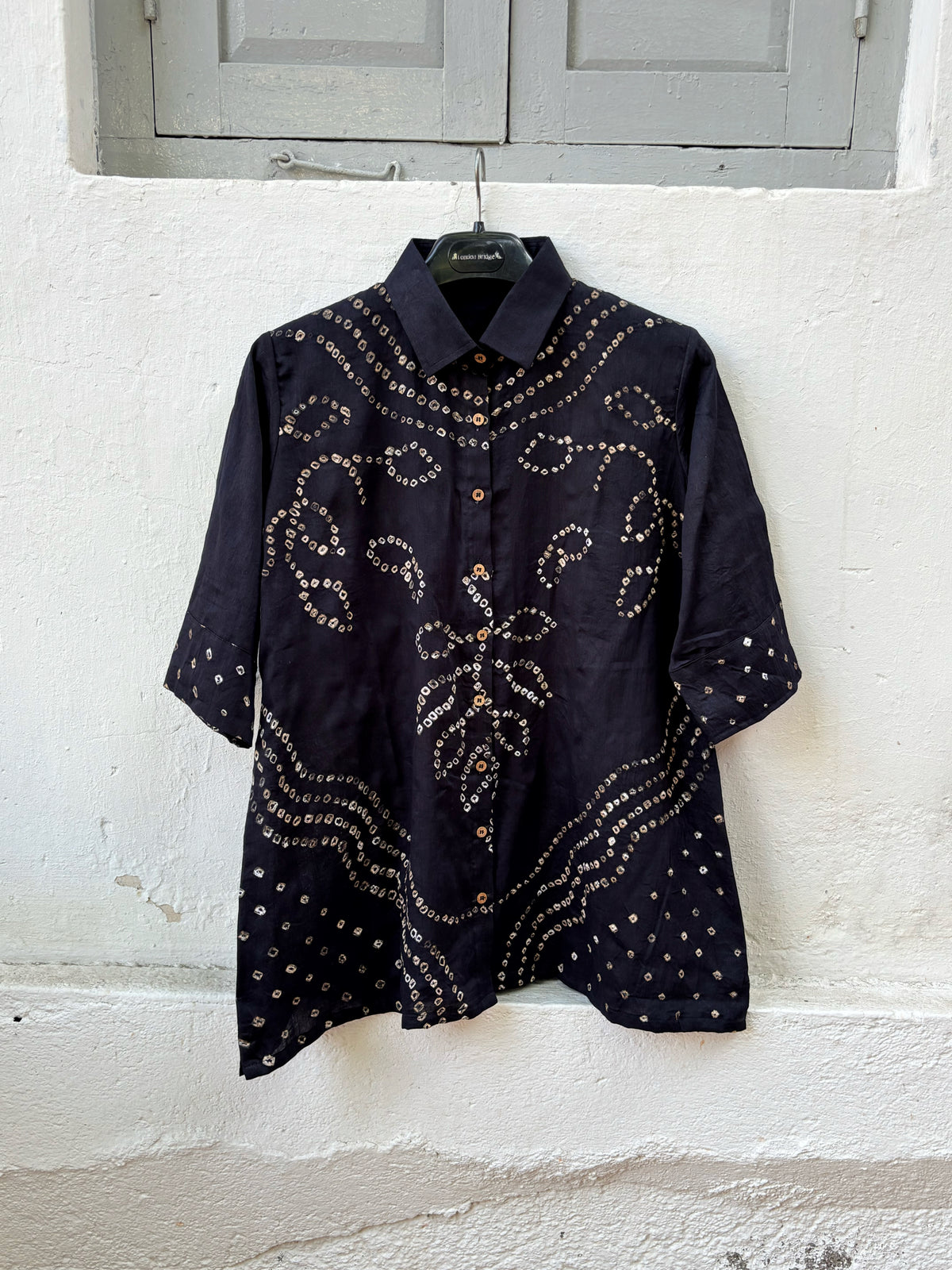 Black Bandhani shirt for women with hand tie dyed ivory patterns in cotton satin, relaxed fit and classic collar design