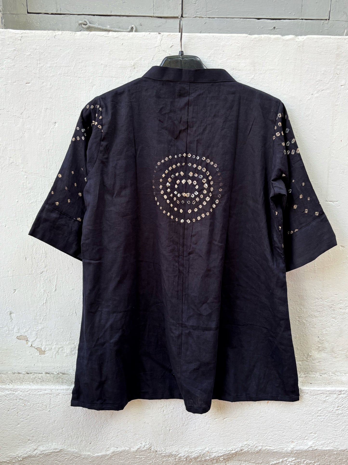 Black Bandhani shirt for women with mandarin collar and cuff sleeves, hand tie dyed ivory patterns on cotton satin, relaxed fit.
