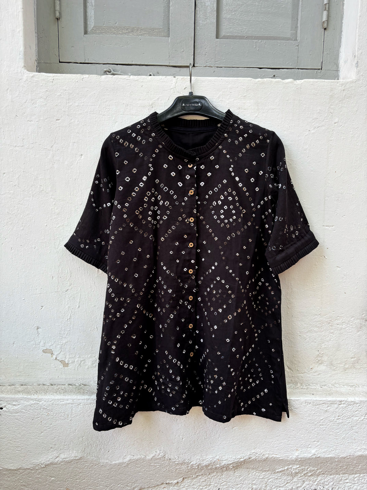 Black Bandhani shirt for women with pleated neckline and sleeve hems, hand tie dyed geometric patterns on cotton satin, relaxed fit