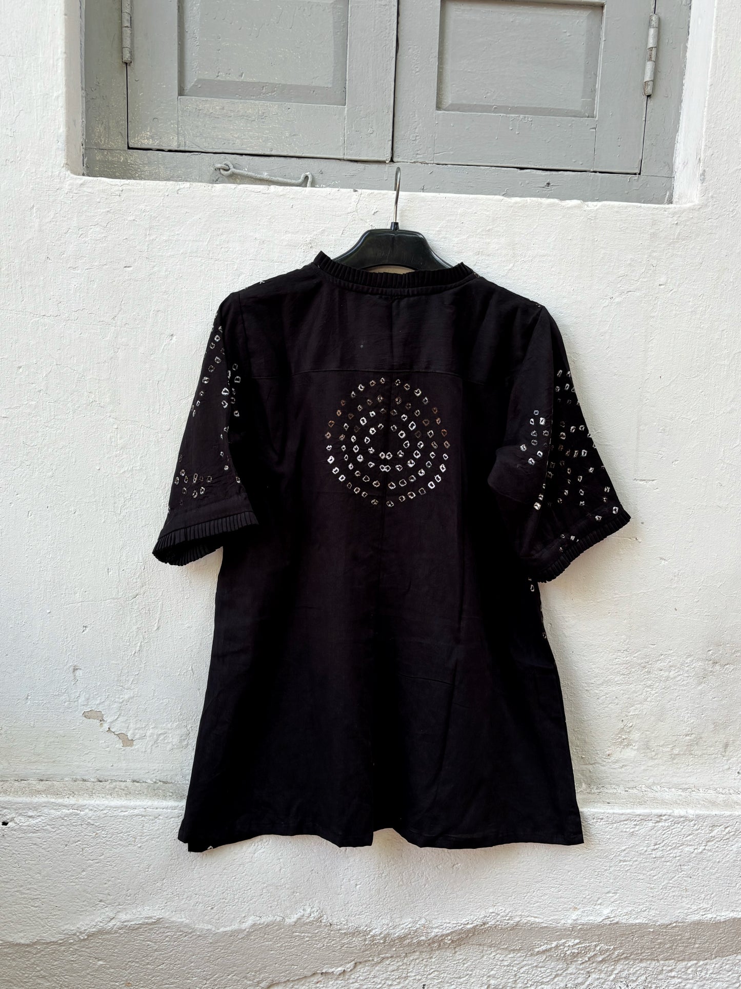 Black Bandhani shirt for women with pleated neckline and sleeve hems, hand tie dyed geometric patterns on cotton satin, relaxed fit