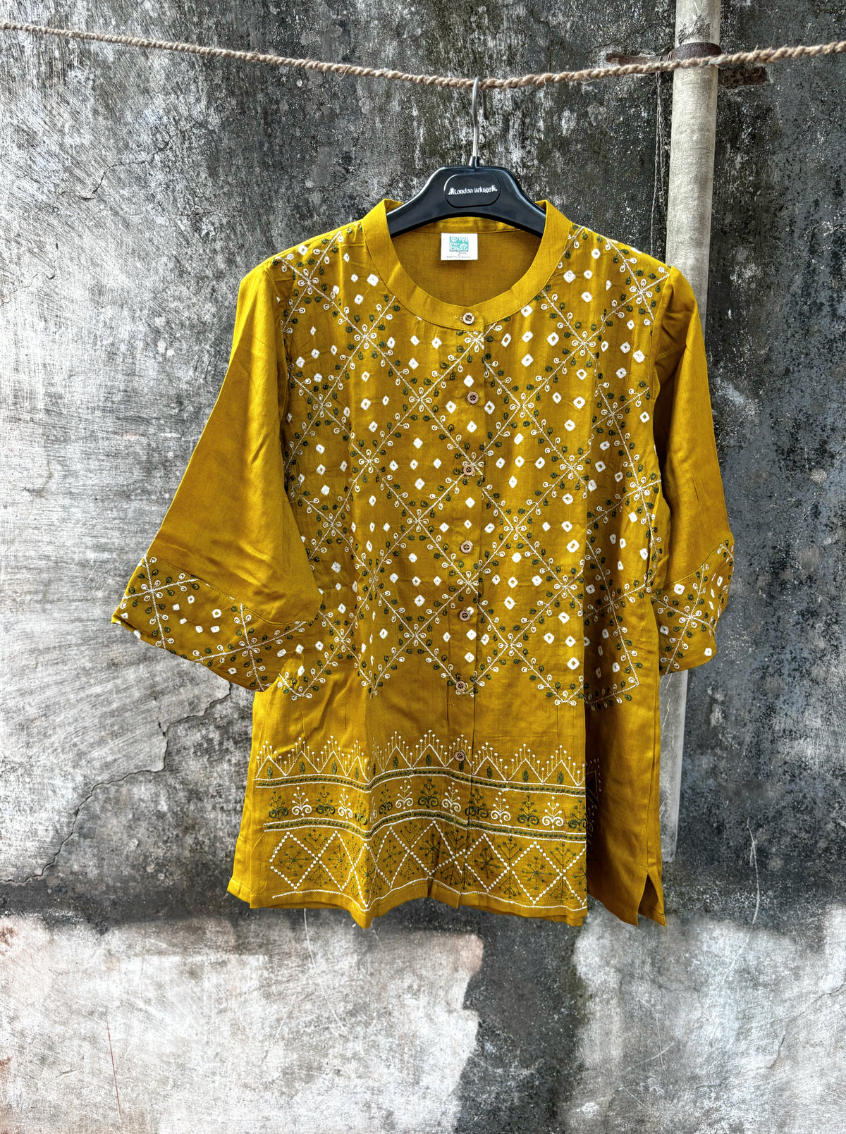 Dhoop mustard-gold hand tie-dyed Bandhani cotton satin shirt with geometric machine embroidery