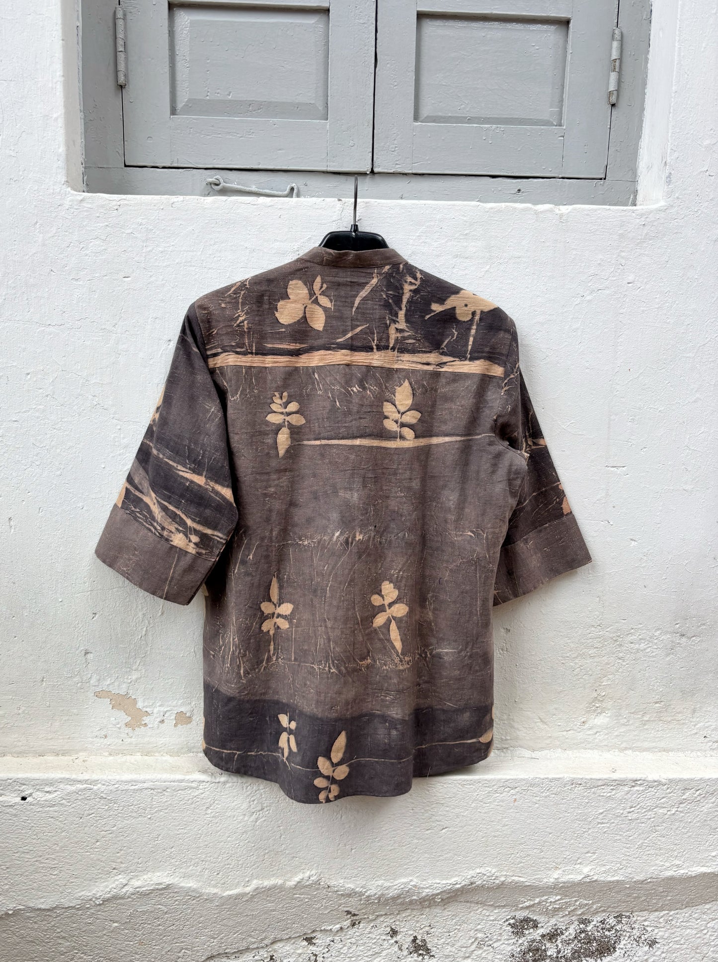 Hand-spun and hand-woven cotton shirt naturally dyed in earthy brown-grey with botanical eco prints