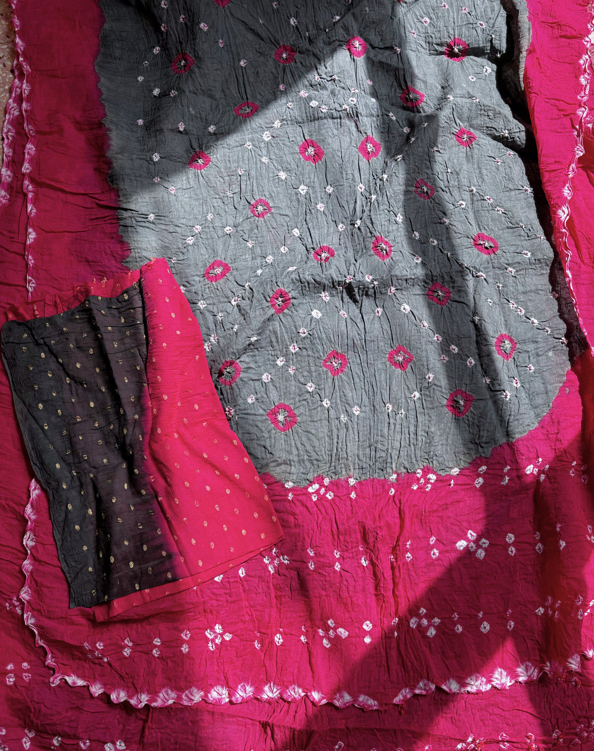 Gulabi pink and grey hand tie-dyed Bandhani cotton saree with pink floral motifs and white dotted patterns