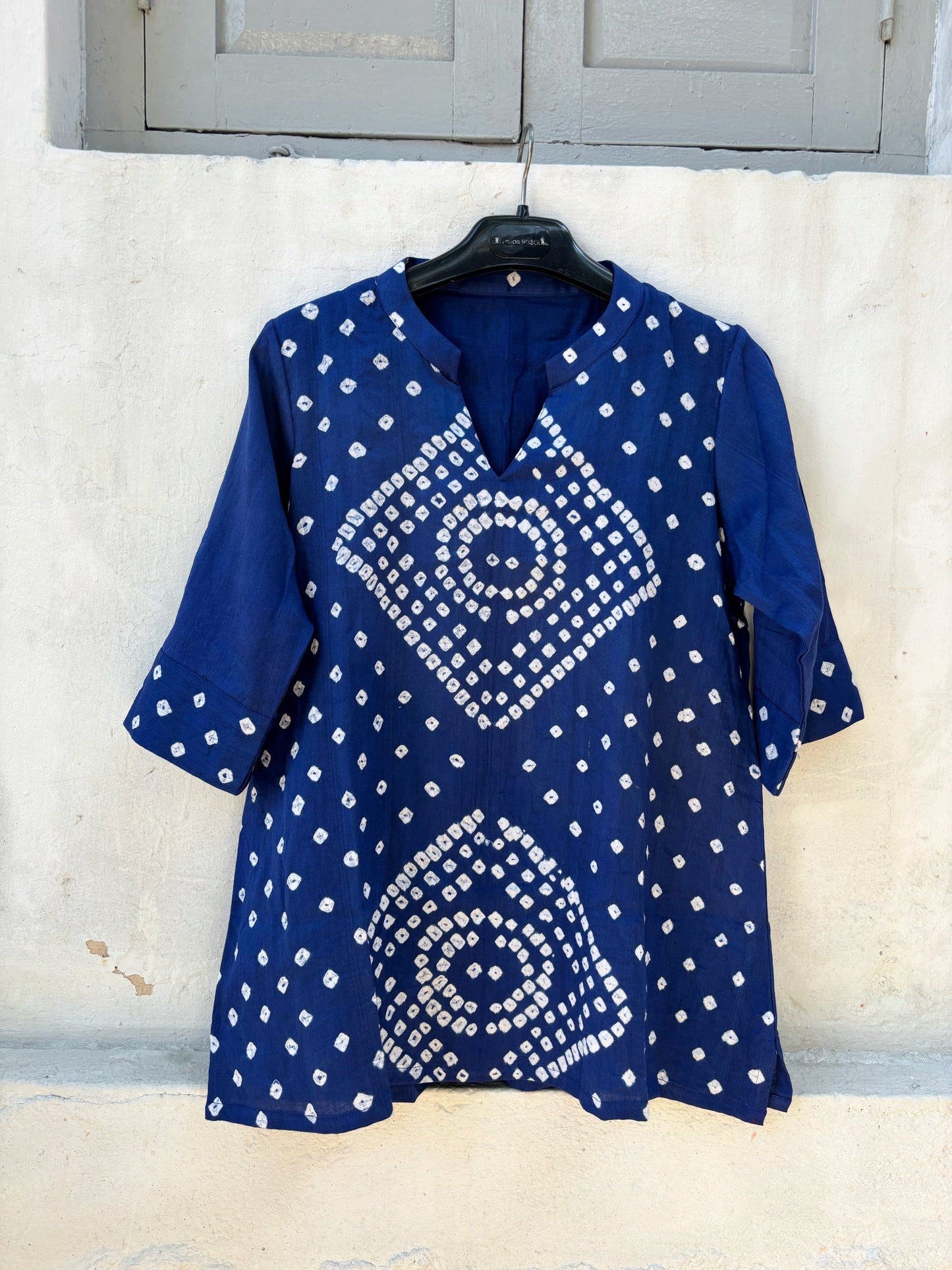 Indigo Bandhani top for women with circular chakra-inspired hand tie dyed patterns in cotton satin, relaxed fit and V-slit neckline