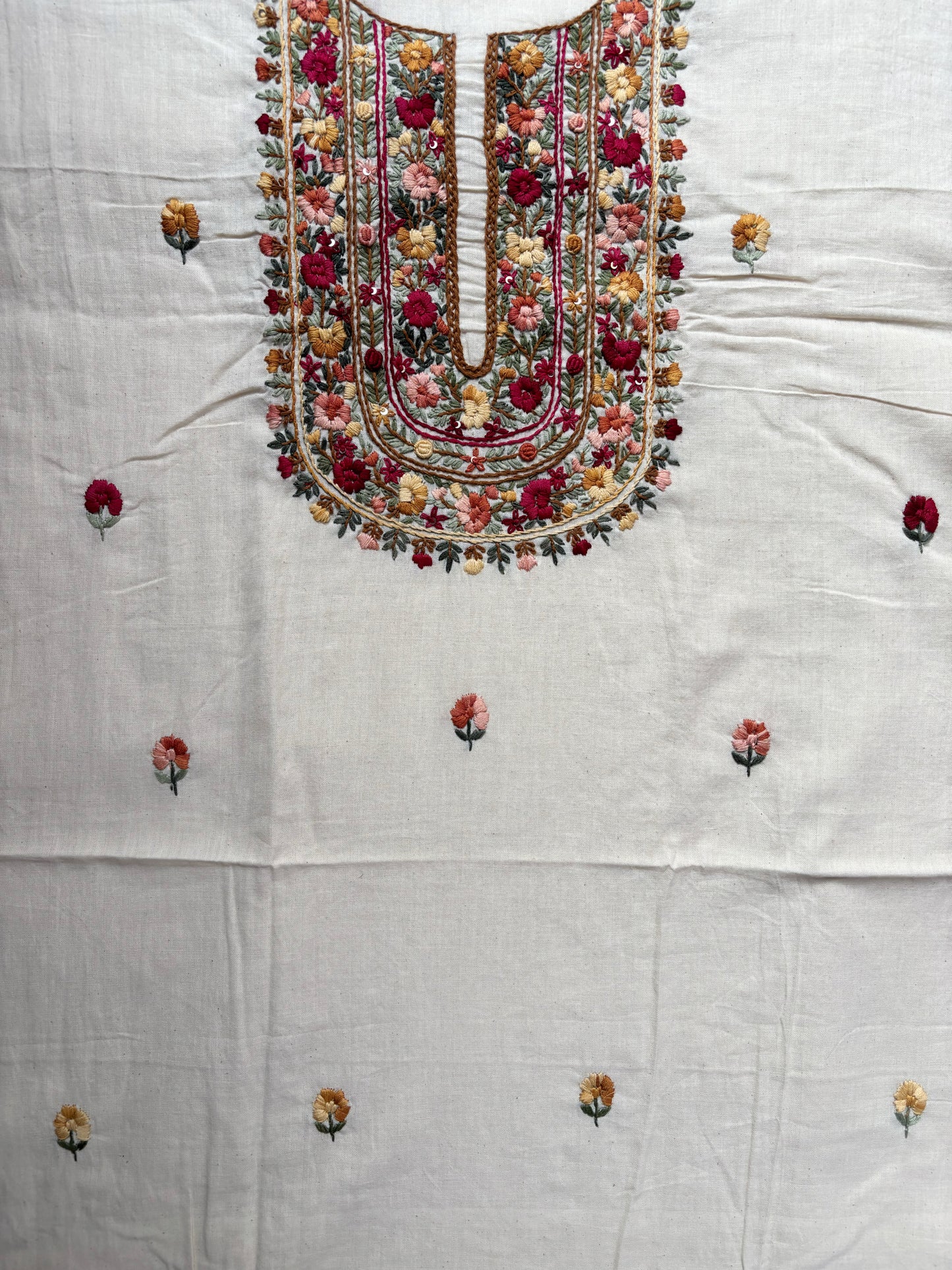 Handspun cotton unstitched kurta dupatta set featuring a richly hand embroidered floral yoke with delicate butti motifs and a matching embroidered dupatta in warm ivory tones.