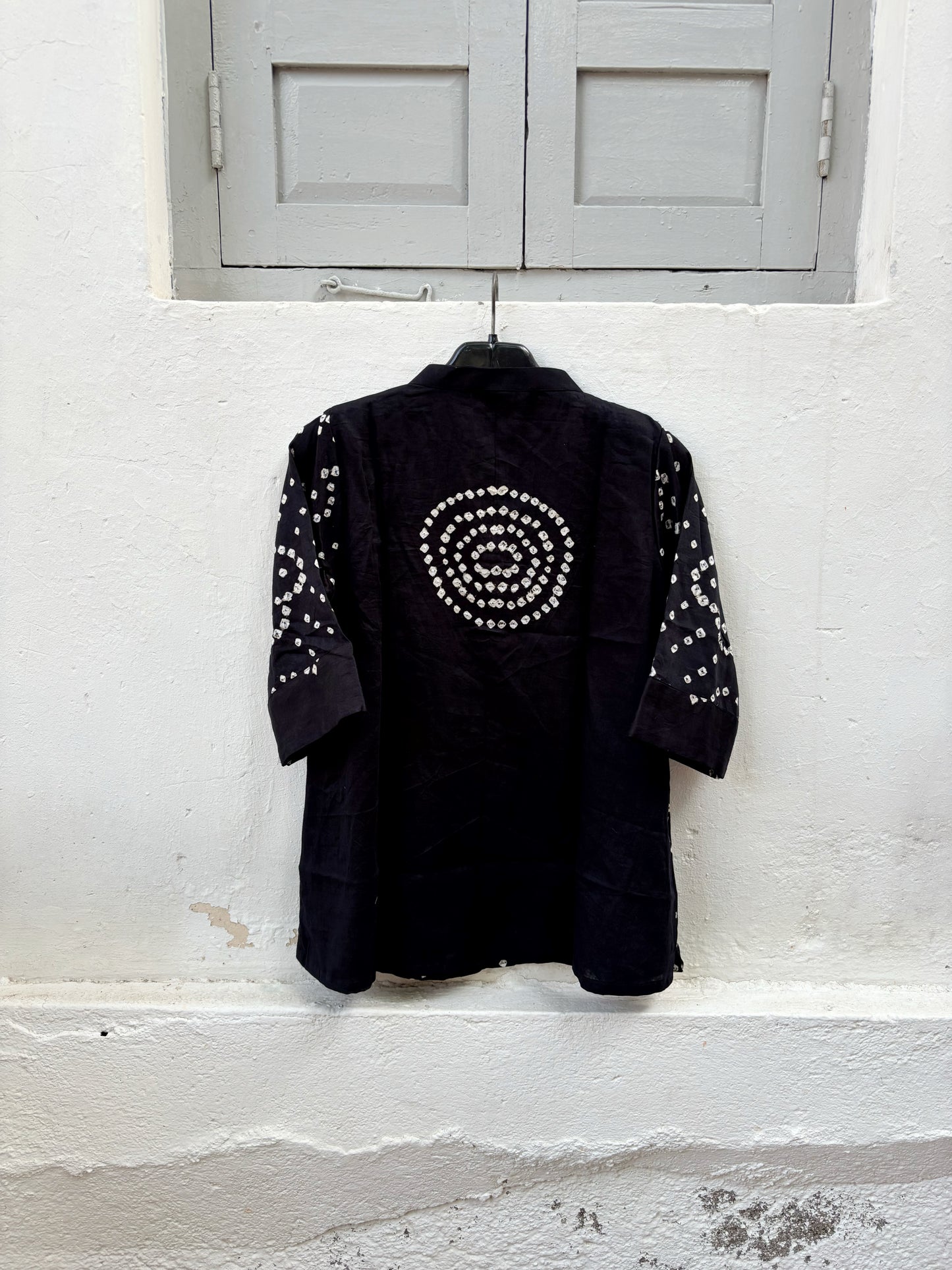 Kali black cotton satin Bandhani shirt with ivory white hand tie-dyed motifs, mandarin collar, folded sleeve cuffs and relaxed fit