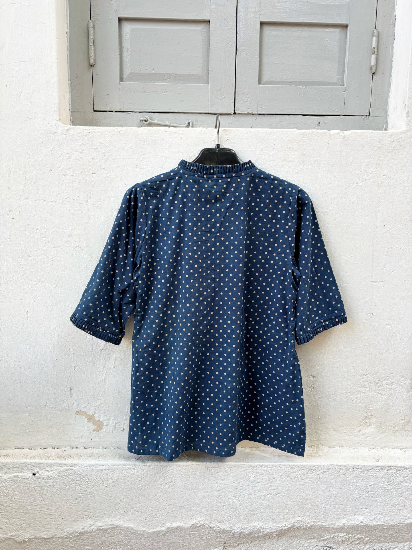 Indigo dyed hand block printed cotton shirt for women with dotted print, pleated neckline and relaxed fit