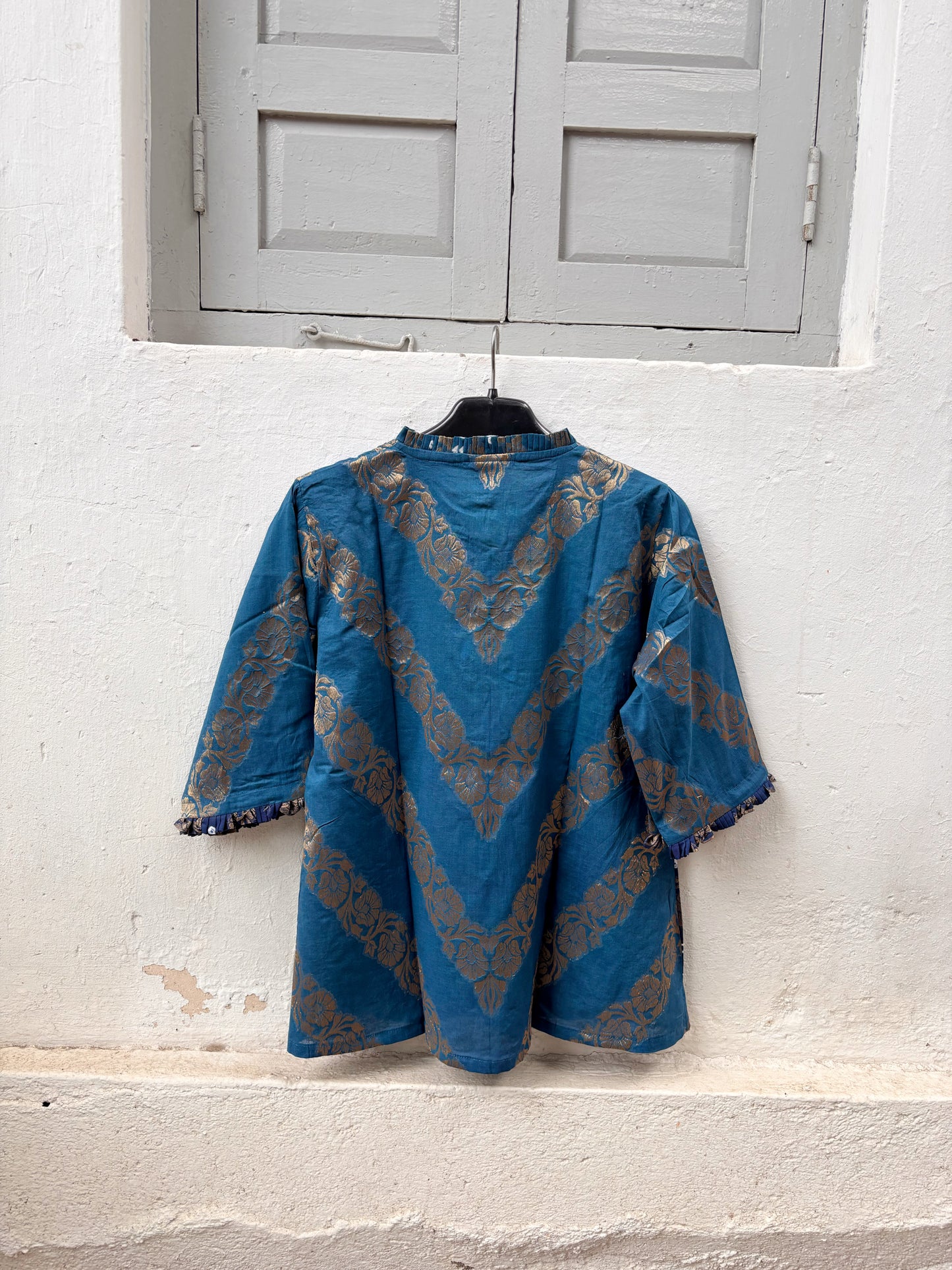 Neeravi festive Bandhani cotton shirt in two shades of teal with ivory hand tie-dyed Bandhani, antique-gold Banarasi floral weave and pleated neckline
