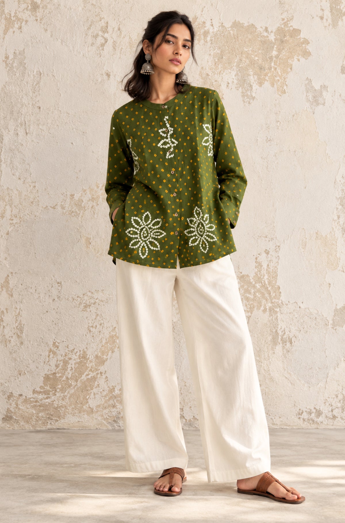 Olive green cotton shirt with turmeric yellow and off-white Bandhani floral motifs, mandarin collar and front-open button closure