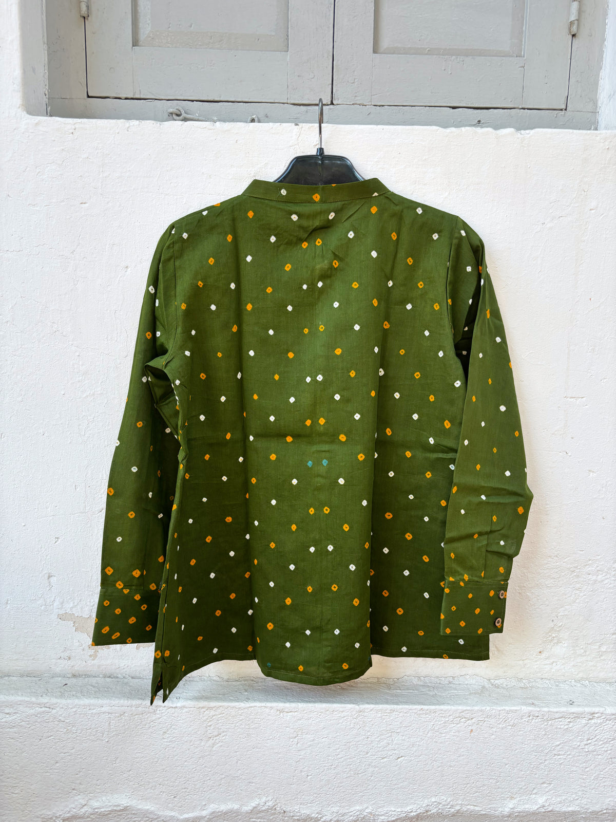 Olive green cotton shirt with turmeric yellow and off-white Bandhani floral motifs, mandarin collar and front-open button closure