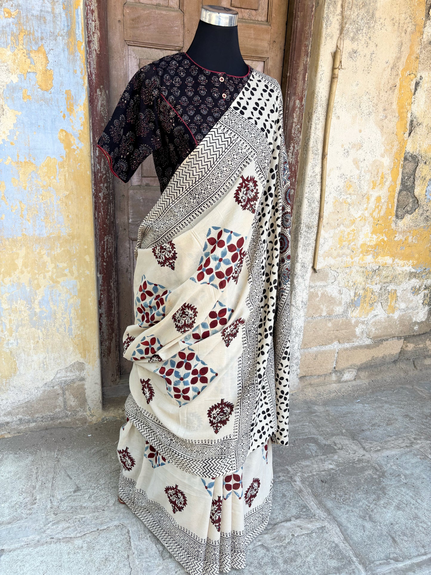 Reva myrobalan dyed Ajrakh hand block printed cotton saree in madder red indigo and black