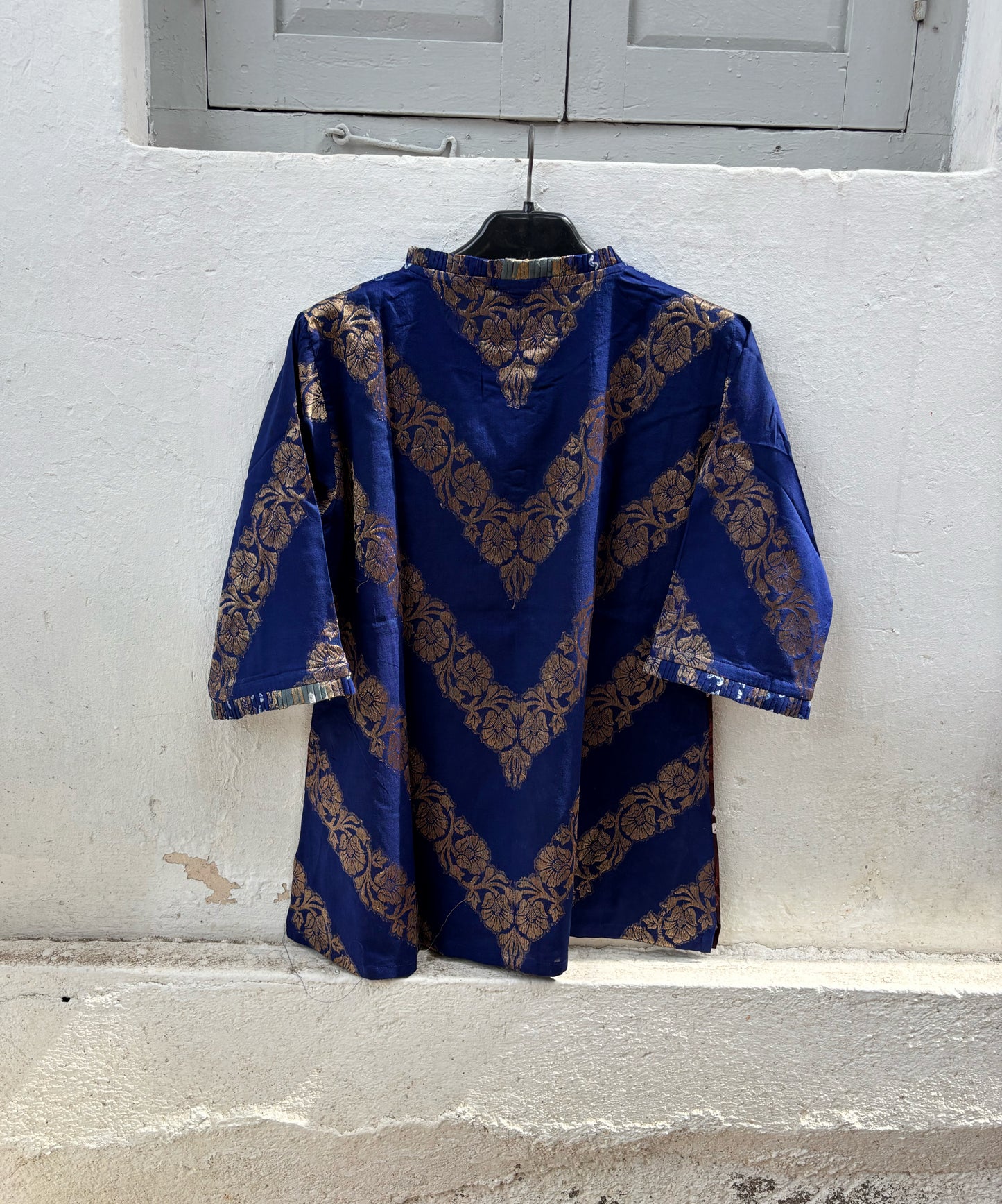 Handcrafted Bandhani festive cotton shirt in Royal Blue, Mist Grey and Wine Maroon with antique gold woven floral motifs, pleated round neckline, front button placket, relaxed fit and elbow length sleeves.