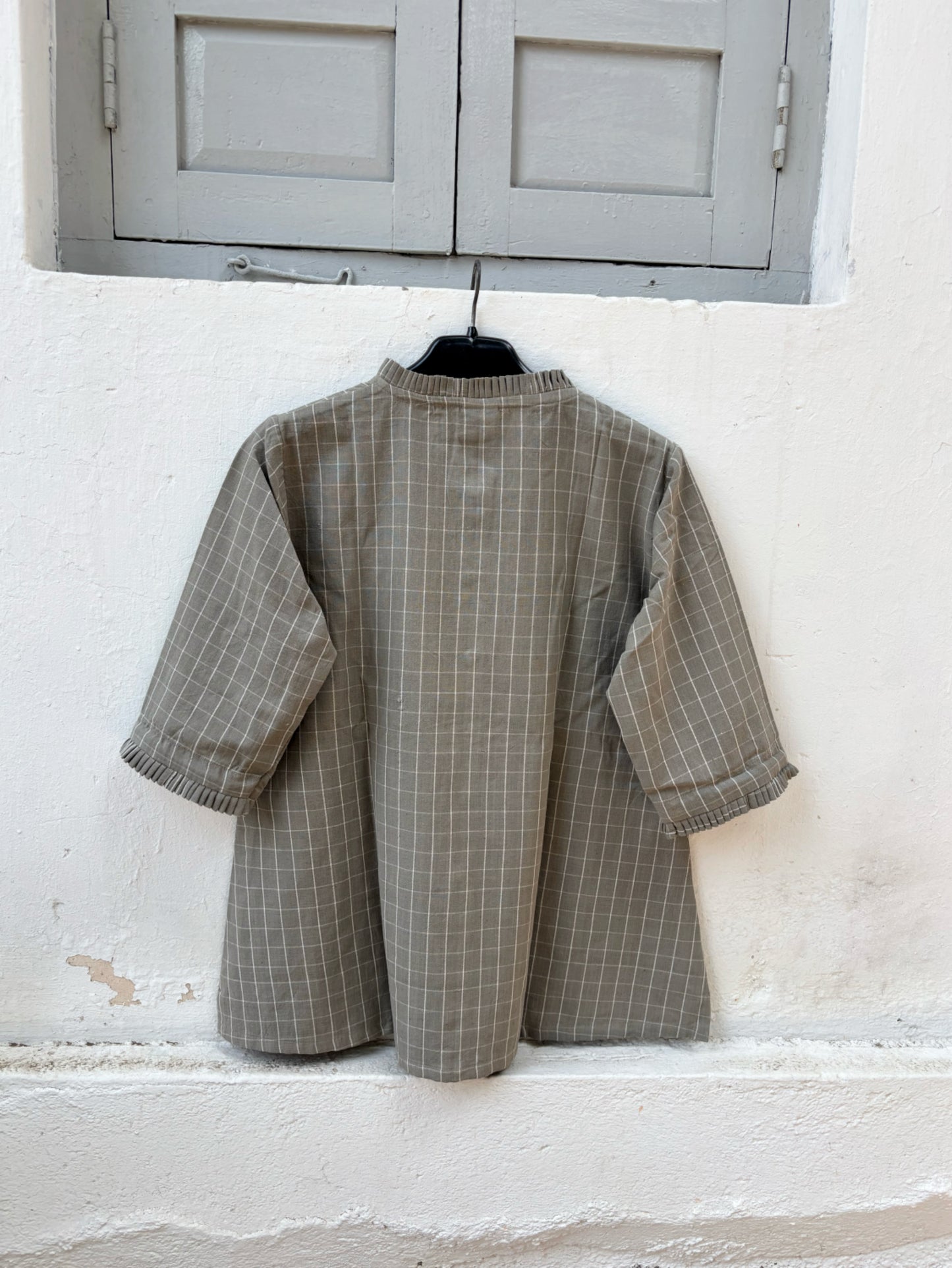 Stone grey hand spun handwoven cotton checks shirt with pleated neckline, pleated sleeve hems and relaxed fit