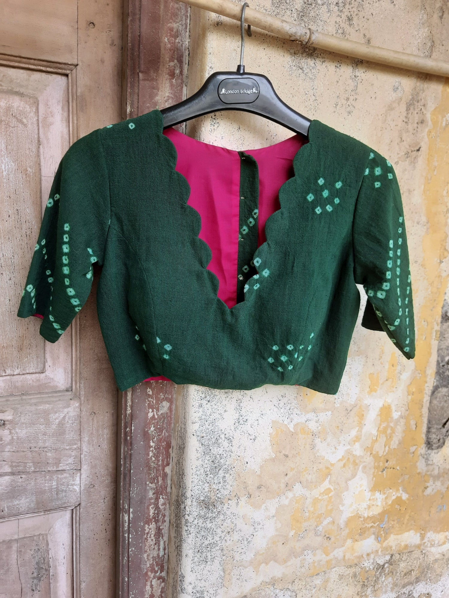 Handcrafted blouses made with Bandhani tie-dye and Ajrakh hand block printing on organic cotton, silks, and linens — slow-made, elegant, and eco-conscious.