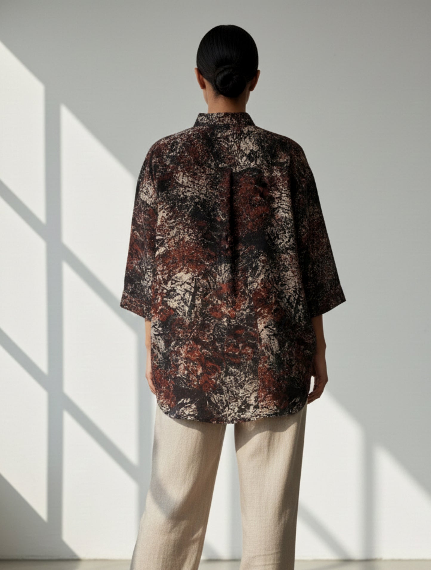 Abstract Ajrakh hand-printed black cotton oversized shirt for women, naturally dyed with mandarin collar.