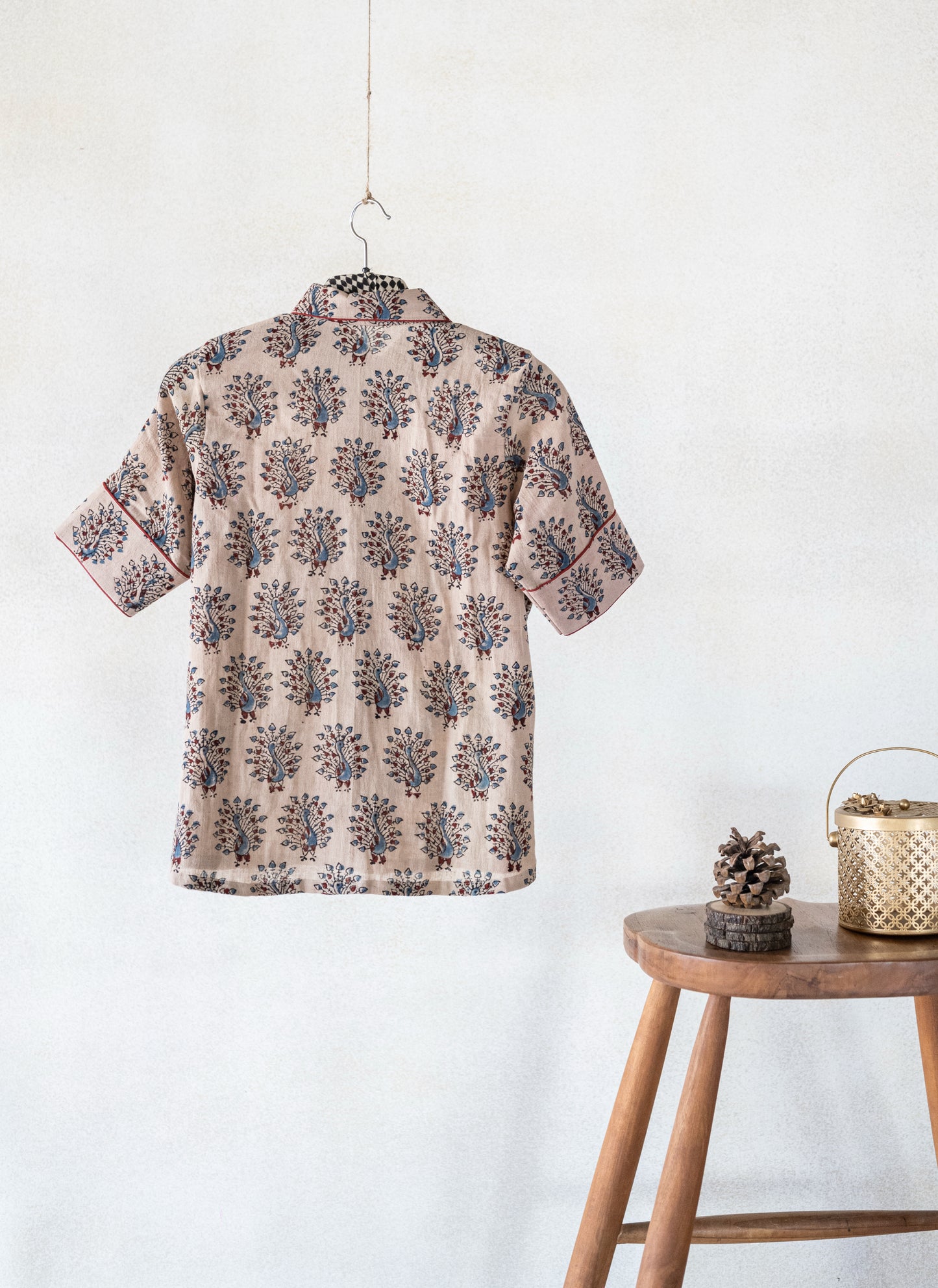 Hand spun and handwoven organic cotton beige Ajrakh hand block printed shirt for women featuring peacock motif and madder dyed piping on collar and cuffs, naturally dyed and crafted for breathable everyday comfort.