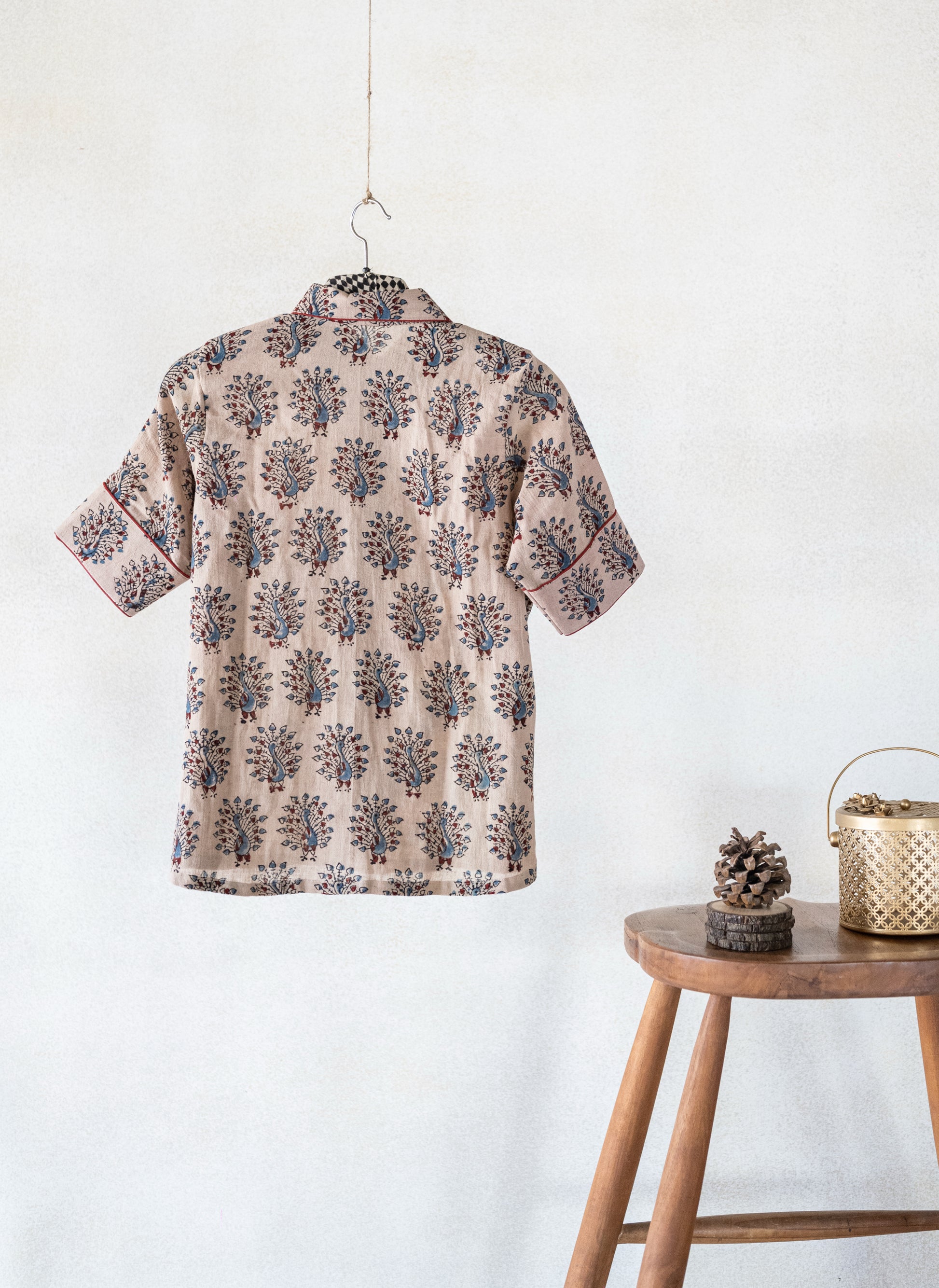 Hand spun and handwoven organic cotton beige Ajrakh hand block printed shirt for women featuring peacock motif and madder dyed piping on collar and cuffs, naturally dyed and crafted for breathable everyday comfort.