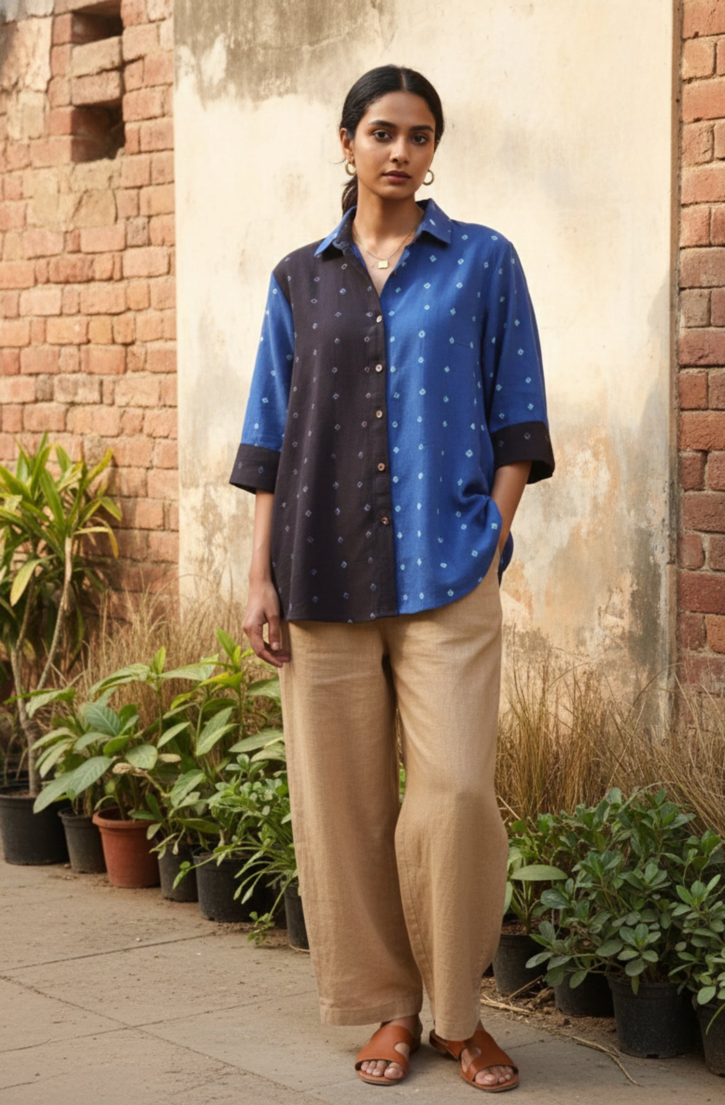 Blue and black half-and-half Bandhani oversized shirt crafted in organic cotton, featuring hand tie dyed patterns on both panels. Relaxed oversized fit, breathable and slow made women’s shirt handcrafted using traditional Bandhani techniques in India.