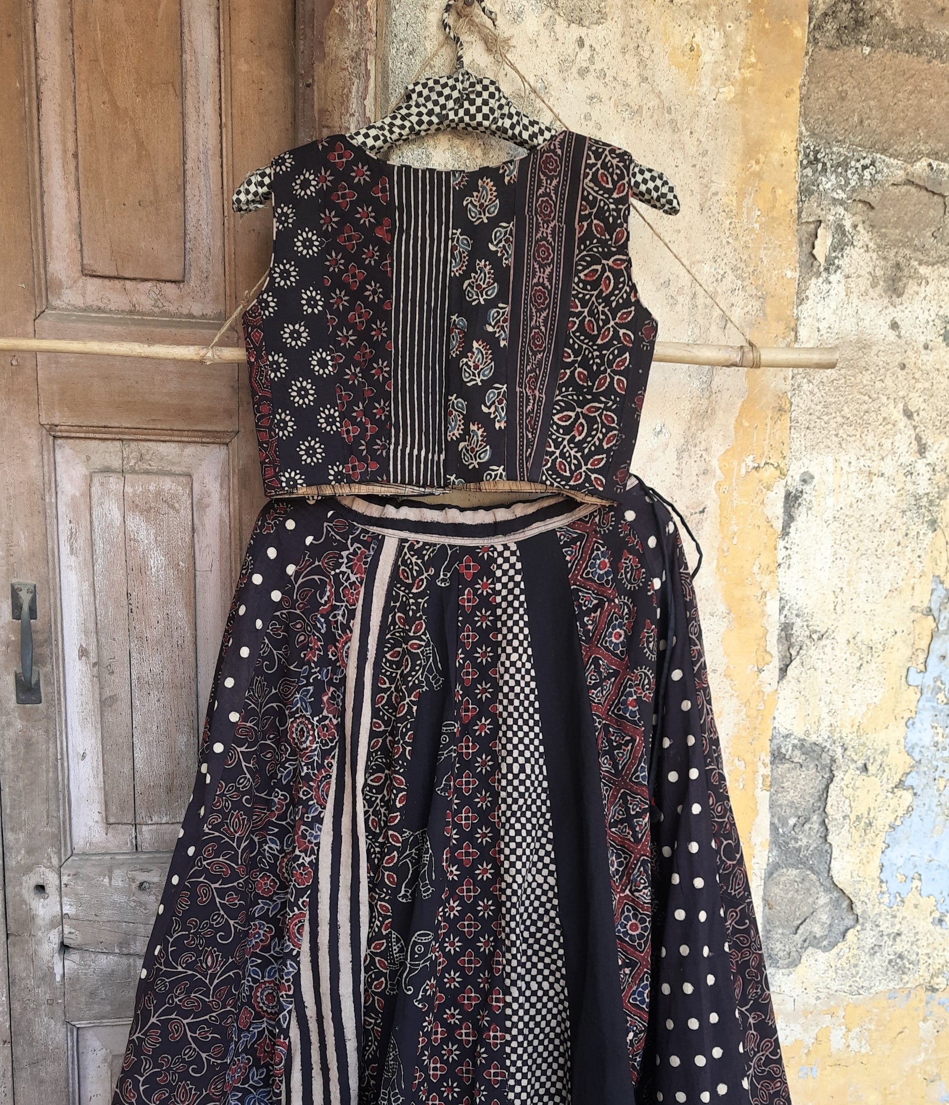 Black natural dyed Ajrakh hand block printed blouse with front button closure, deep curved V-neck, lined and padded cotton fabric