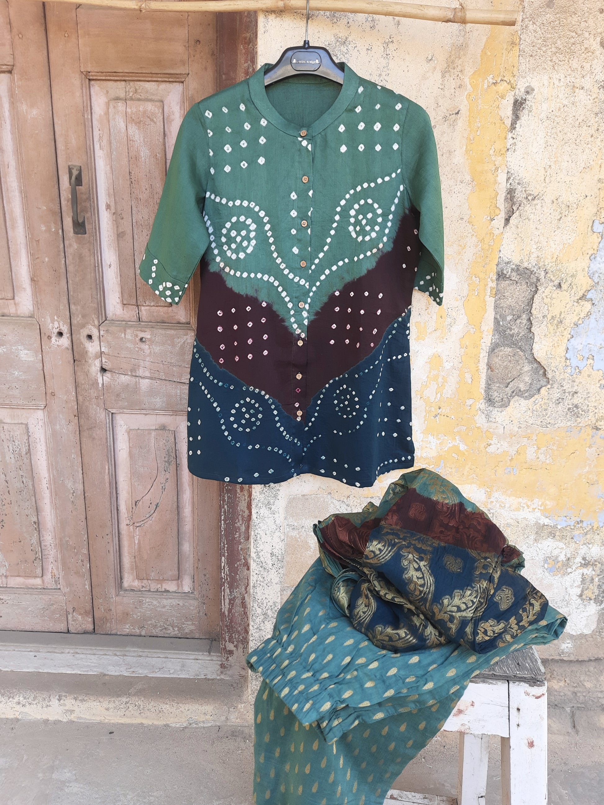 Hand tie dyed Bandhani shirt pant coord set in deep olive green cotton satin with mandarin collar, elasticated pants and Banarasi weave dupatta