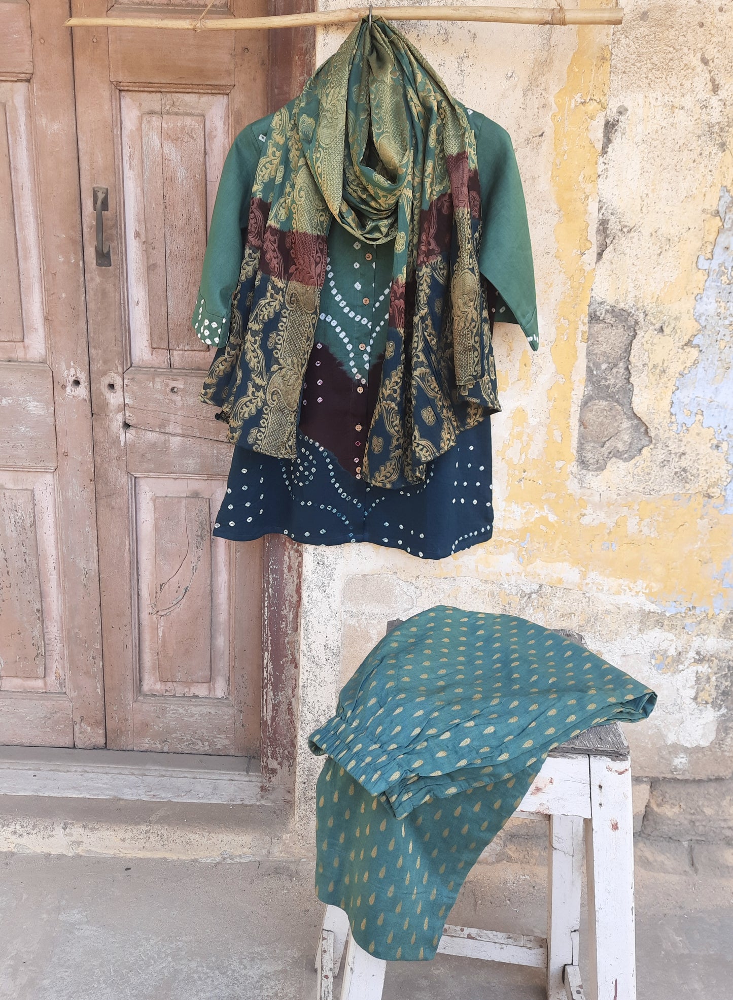 Hand tie dyed Bandhani shirt pant coord set in deep olive green cotton satin with mandarin collar, elasticated pants and Banarasi weave dupatta