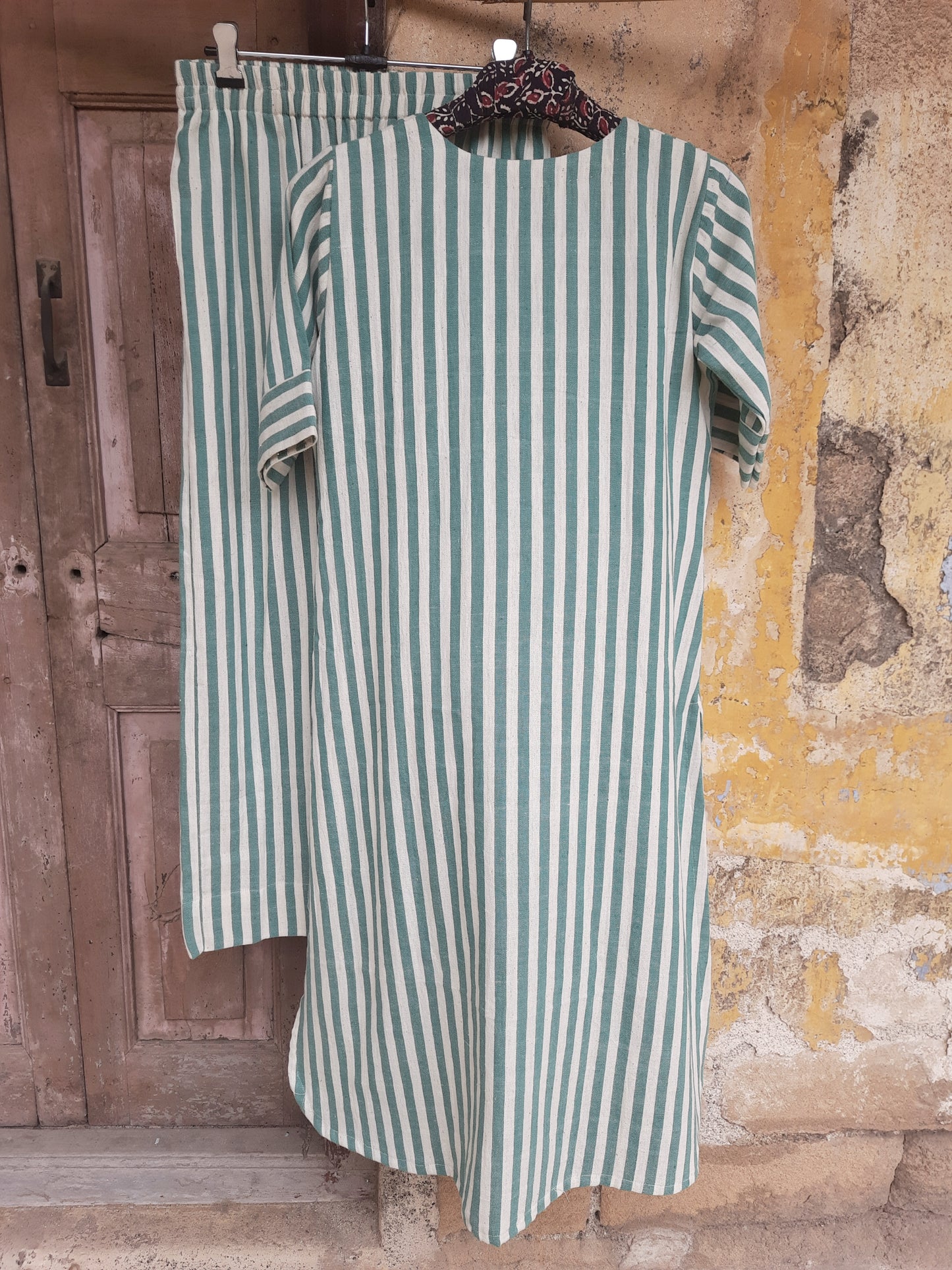 Handwoven organic cotton green and off-white striped co-ord set with round-neck kurta and elasticated waist pants, handmade by artisans, breathable and comfortable sustainable clothing from Turquoisethestore.