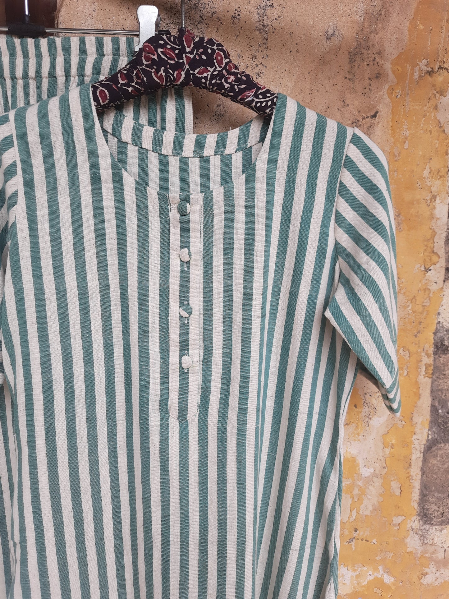 Handwoven organic cotton green and off-white striped co-ord set with round-neck kurta and elasticated waist pants, handmade by artisans, breathable and comfortable sustainable clothing from Turquoisethestore.