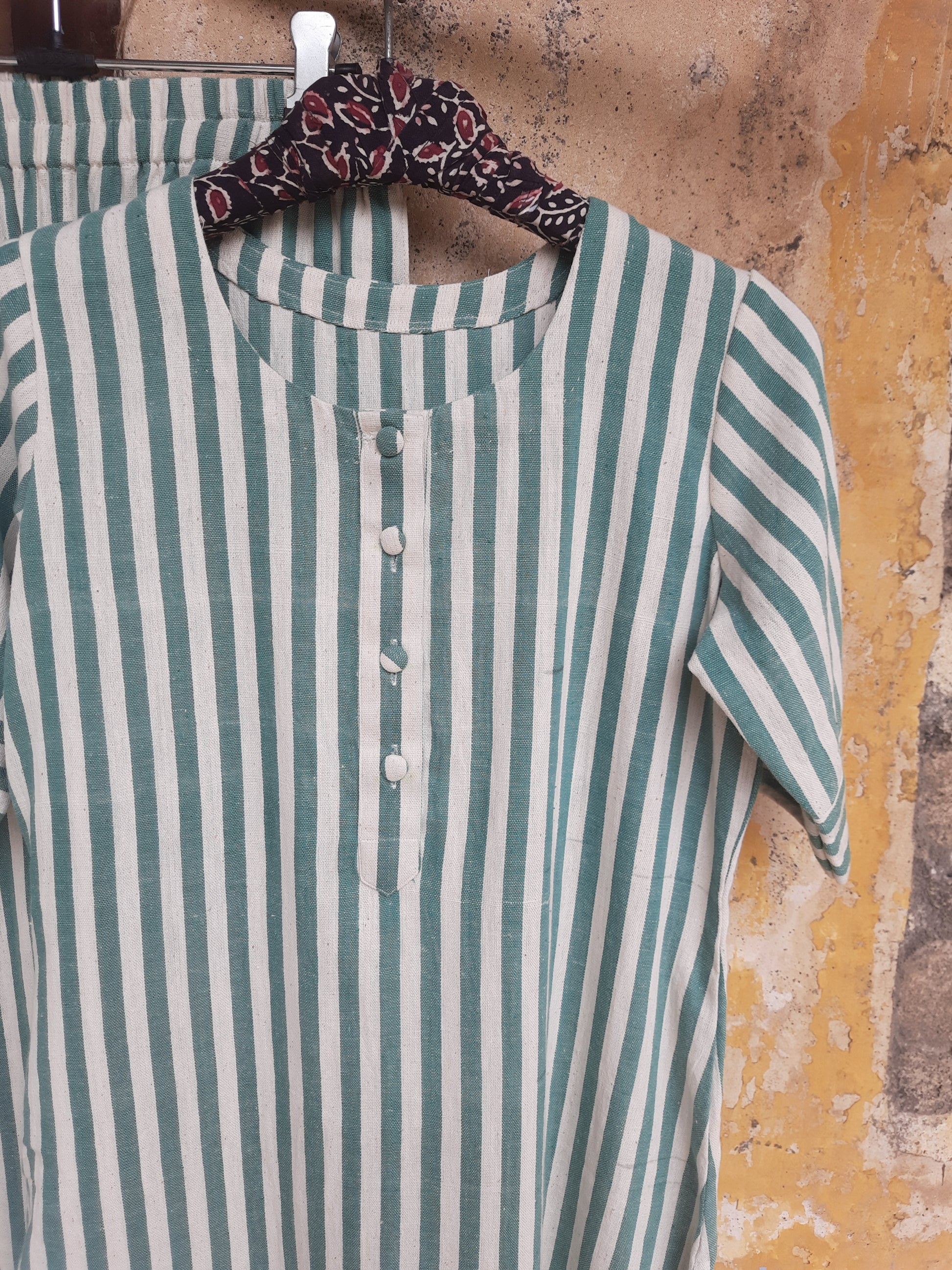 Handwoven organic cotton green and off-white striped co-ord set with round-neck kurta and elasticated waist pants, handmade by artisans, breathable and comfortable sustainable clothing from Turquoisethestore.
