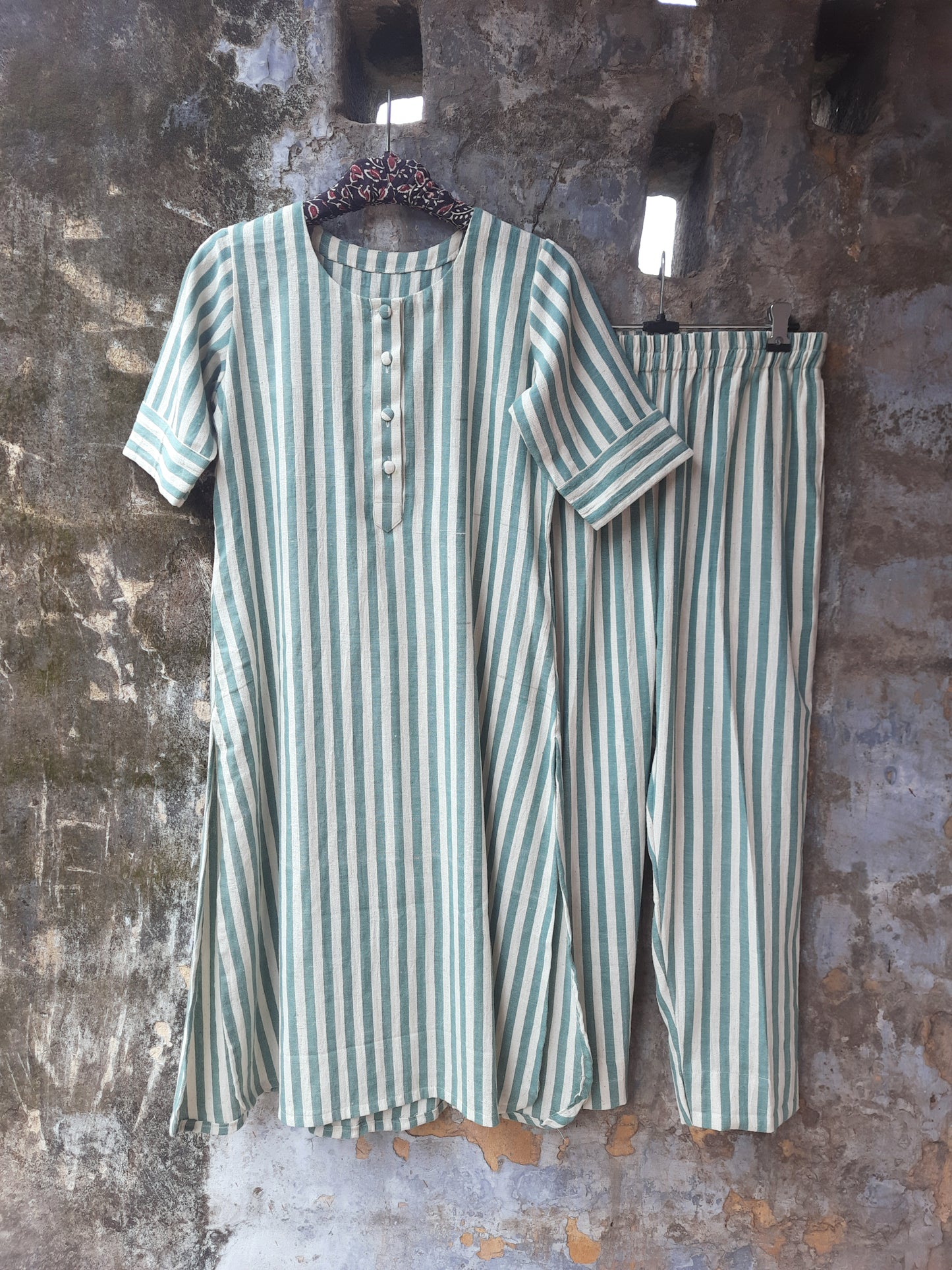 Handwoven organic cotton green and off-white striped co-ord set with round-neck kurta and elasticated waist pants, handmade by artisans, breathable and comfortable sustainable clothing from Turquoisethestore.