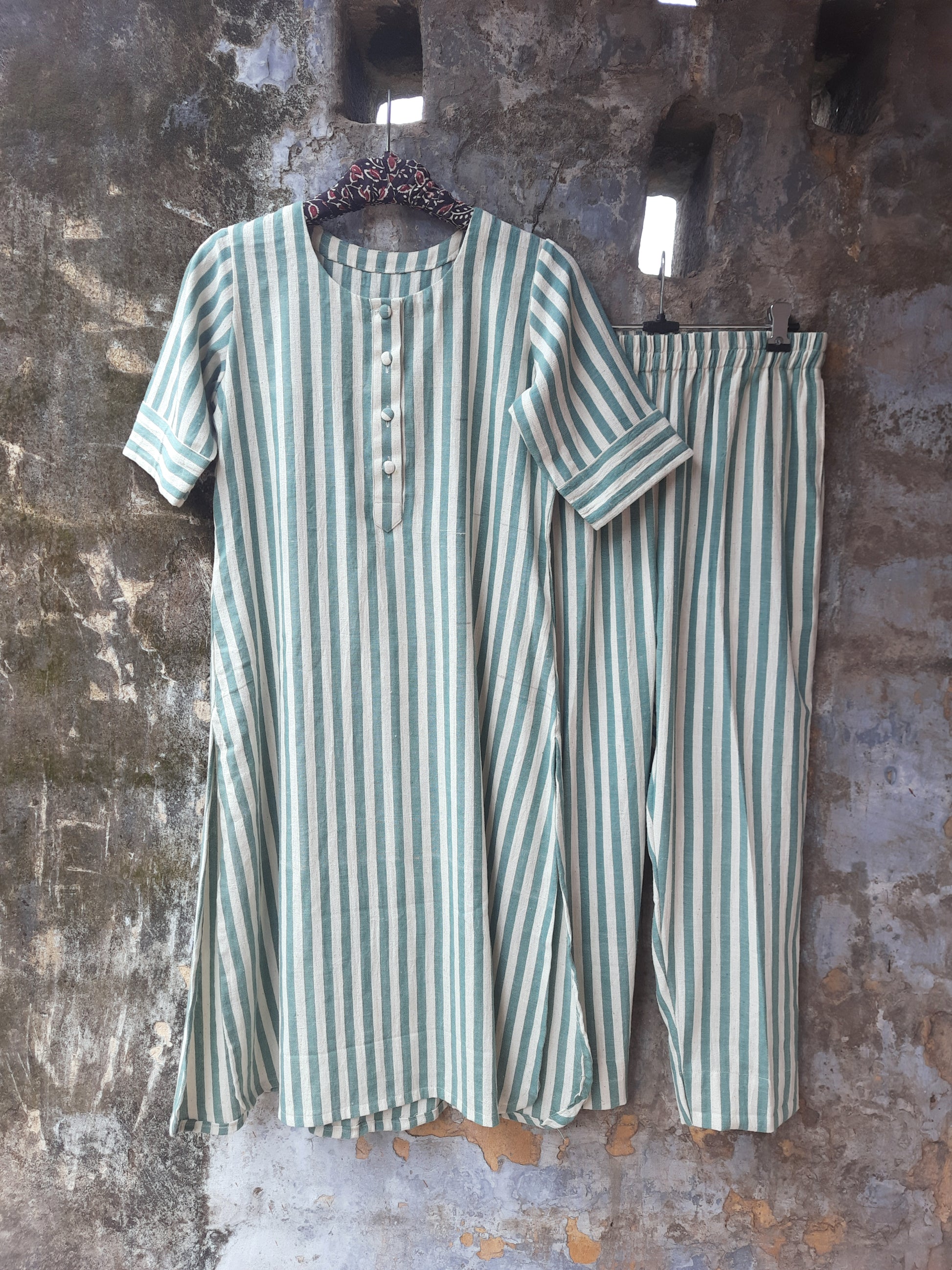 Handwoven organic cotton green and off-white striped co-ord set with round-neck kurta and elasticated waist pants, handmade by artisans, breathable and comfortable sustainable clothing from Turquoisethestore.
