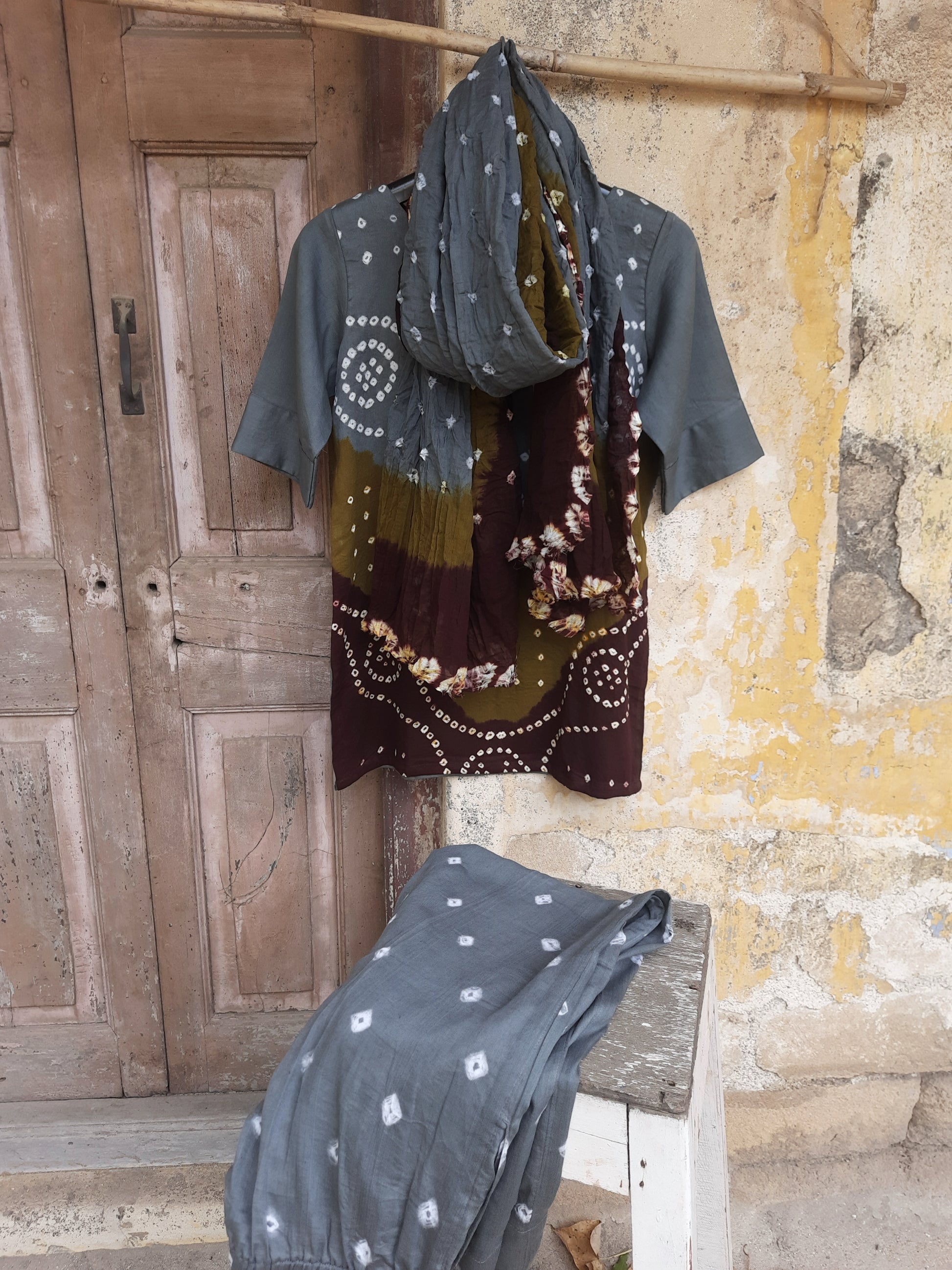 Hand tie-dyed Bandhani three-piece co-ord set in grey, olive and maroon with cotton satin top, elastic pants and cotton dupatta.