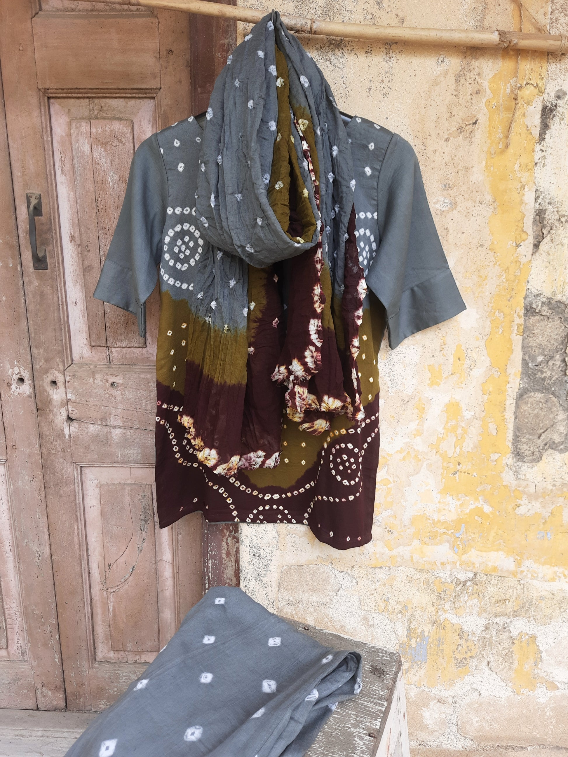 Hand tie-dyed Bandhani three-piece co-ord set in grey, olive and maroon with cotton satin top, elastic pants and cotton dupatta.