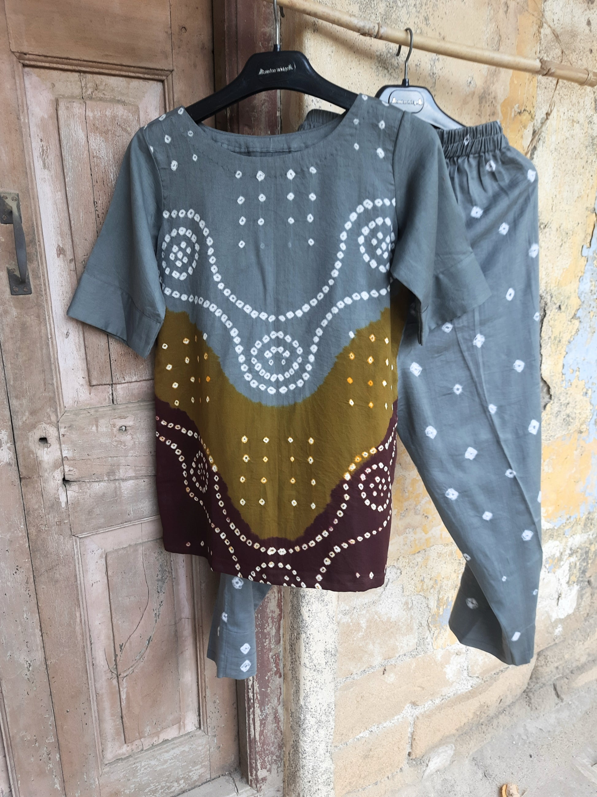 Hand tie-dyed Bandhani three-piece co-ord set in grey, olive and maroon with cotton satin top, elastic pants and cotton dupatta.