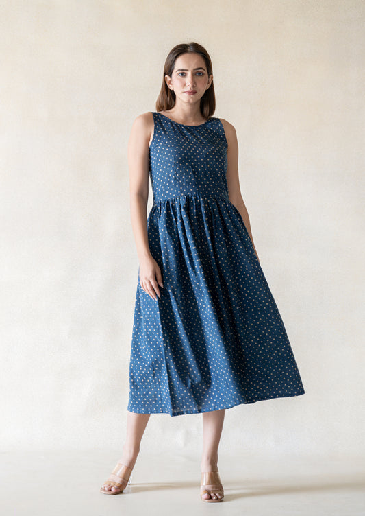 Indigo polka dot cotton dress with a relaxed silhouette and gentle gathers. Easy everyday dress in indigo colour, breathable and lightweight, not lined, designed for comfort and effortless wear.