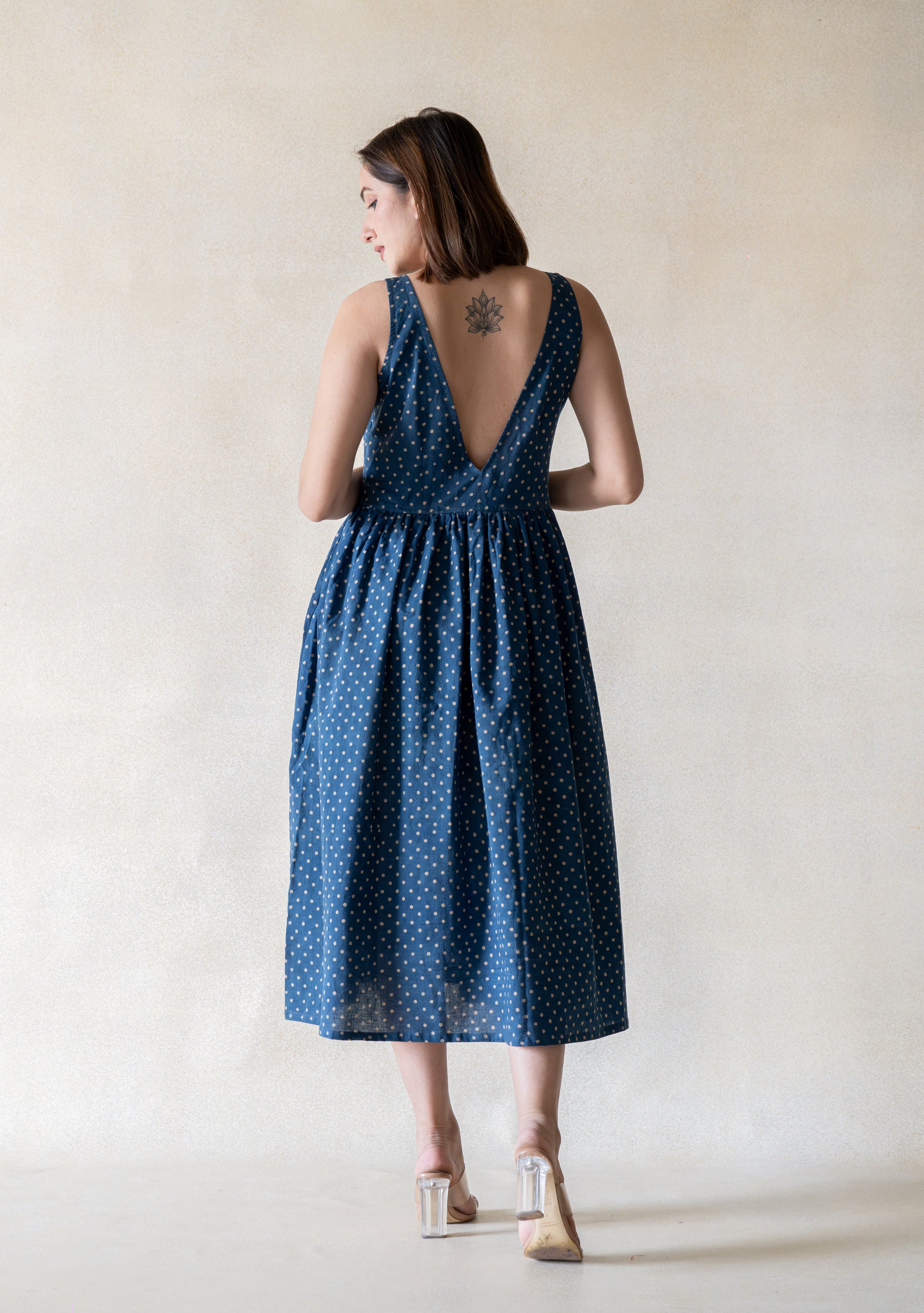 Indigo polka dot cotton dress with a relaxed silhouette and gentle gathers. Easy everyday dress in indigo colour, breathable and lightweight, not lined, designed for comfort and effortless wear.