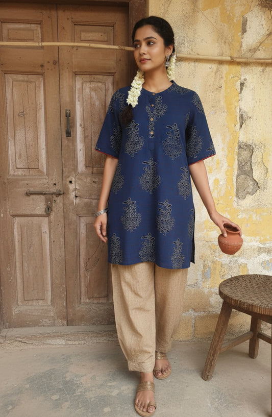 Indigo dyed Ajrakh hand block printed cotton short kurta for women featuring a mandarin collared neck, short sleeves and comfort fit, handcrafted using natural dyes for breathable everyday wear.