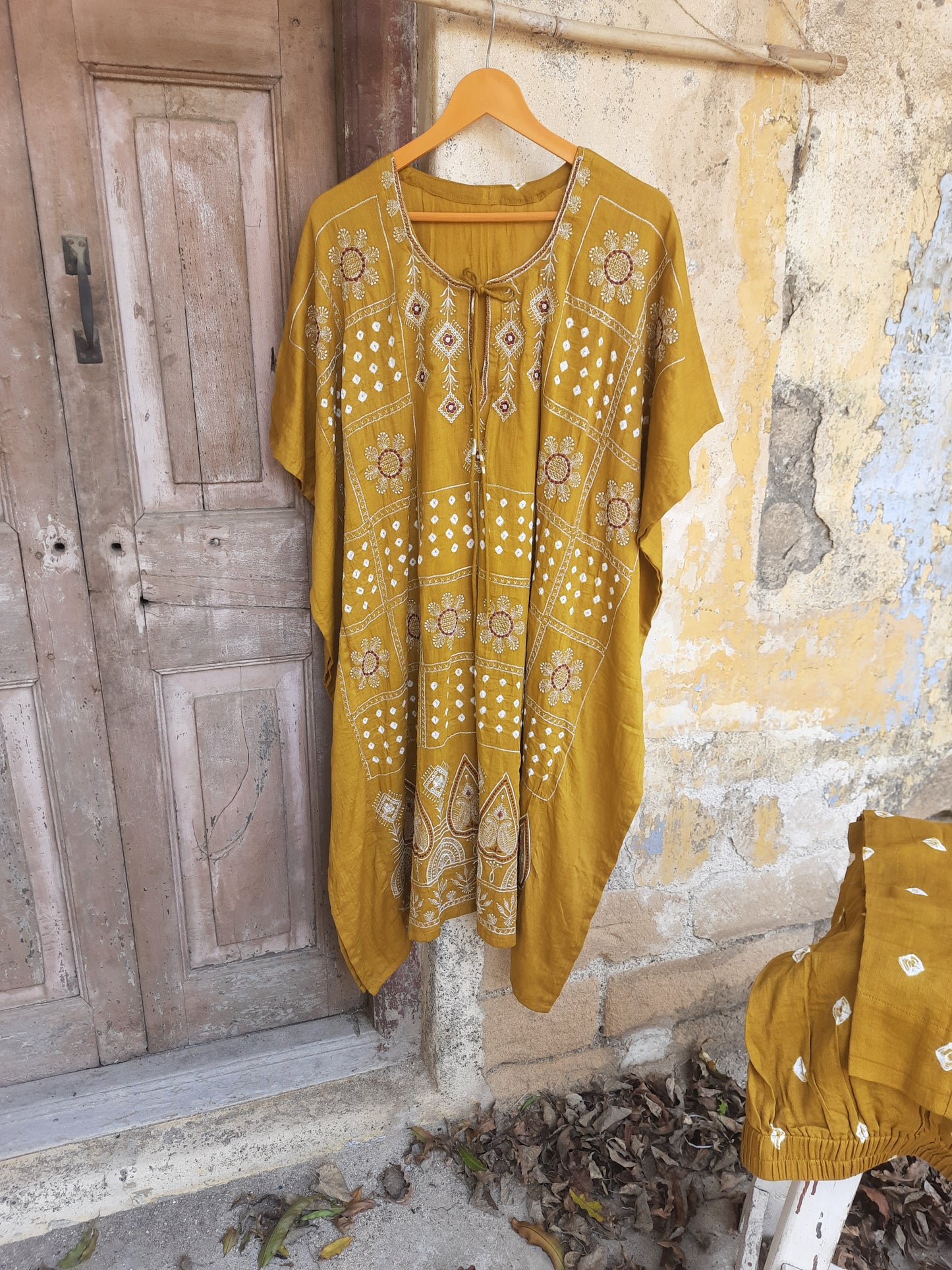 Mustard Bandhani embroidered three-piece set with kaftan, cotton satin pants, and dupatta, handcrafted at Turquoisethestore.